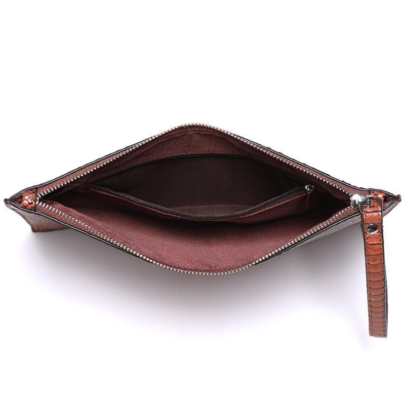 Open view of Python Luxe Clutch - Stylish Simulated Leather Clutch for Sophisticated Women, showing interior compartments.