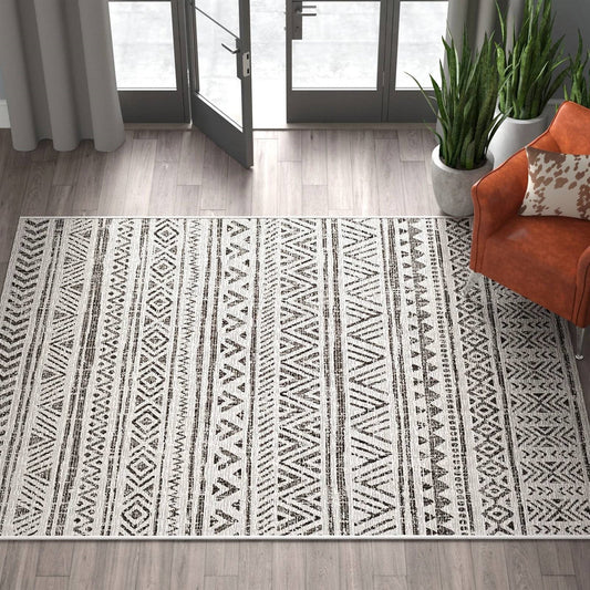 5 ft. x 8 ft. Black Off-White Chevron Coastal Boho Style Indoor Outdoor Area Rug on wood floor