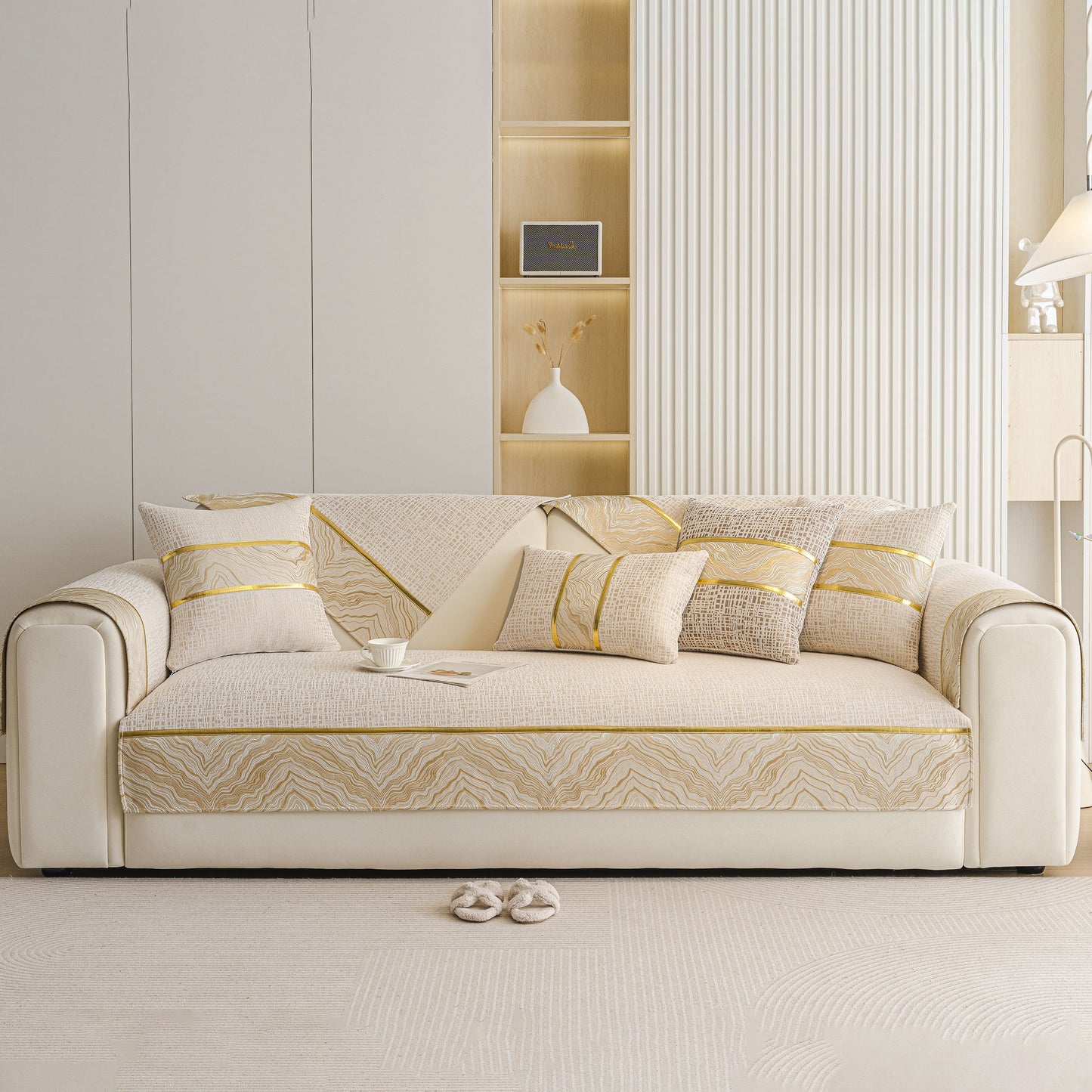 Modern Non-Slip Couch Slipcover, Soft, Durable & Washable Furniture Protector on beige sofa with gold trim.