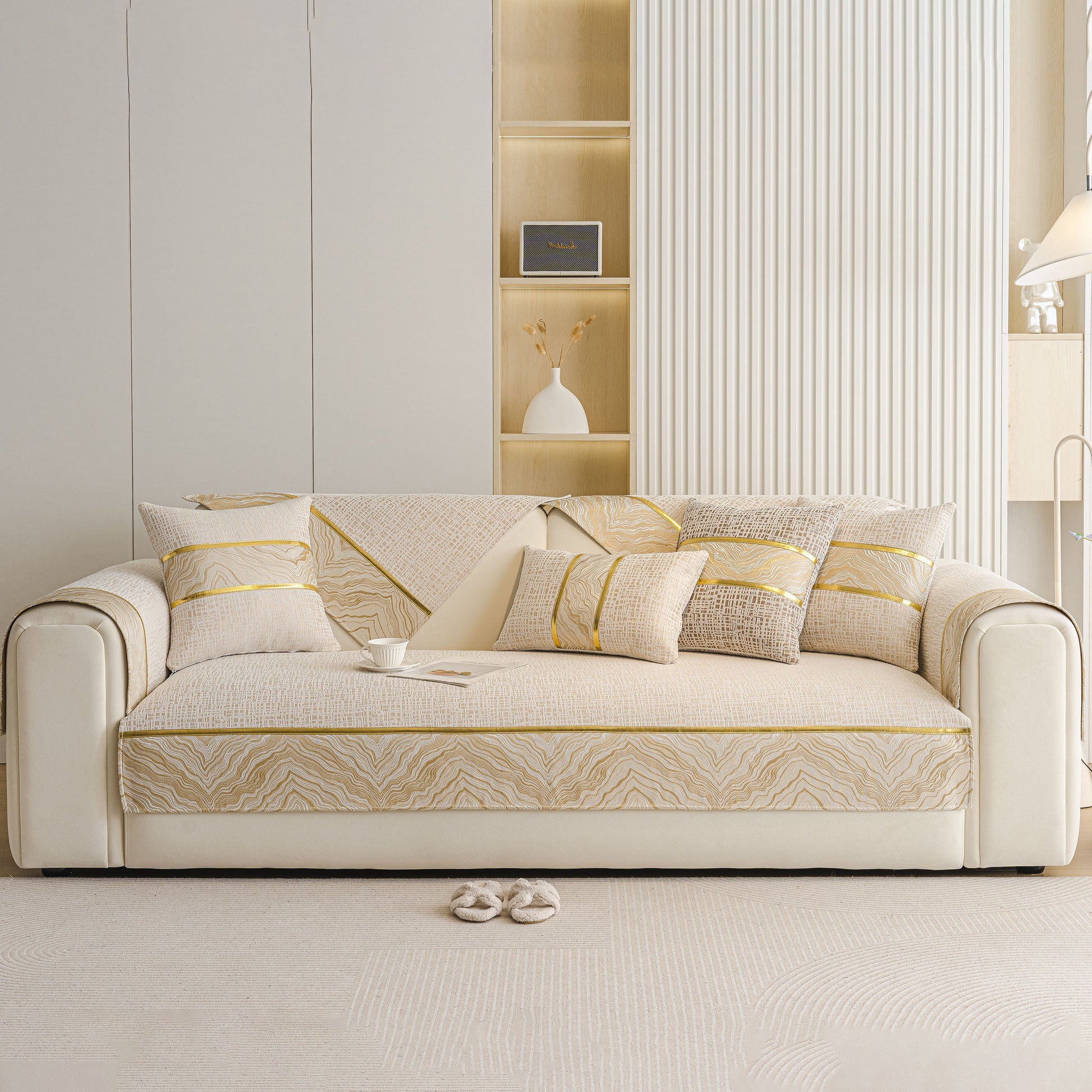 Modern Non-Slip Couch Slipcover, Soft, Durable & Washable Furniture Protector on beige sofa with gold trim.