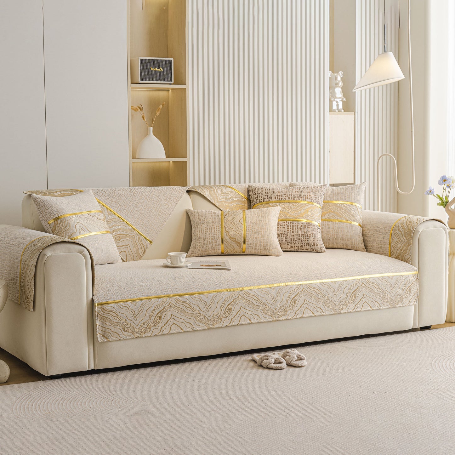 Modern Non-Slip Couch Slipcover, Soft, Durable & Washable Furniture Protector with elegant gold marble-style trim on a beige sofa.