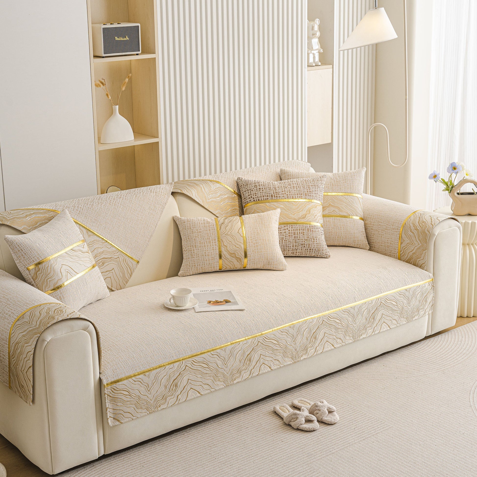 Modern Non-Slip Couch Slipcover, Soft, Durable & Washable Furniture Protector with gold marble-style trim on beige chenille fabric.