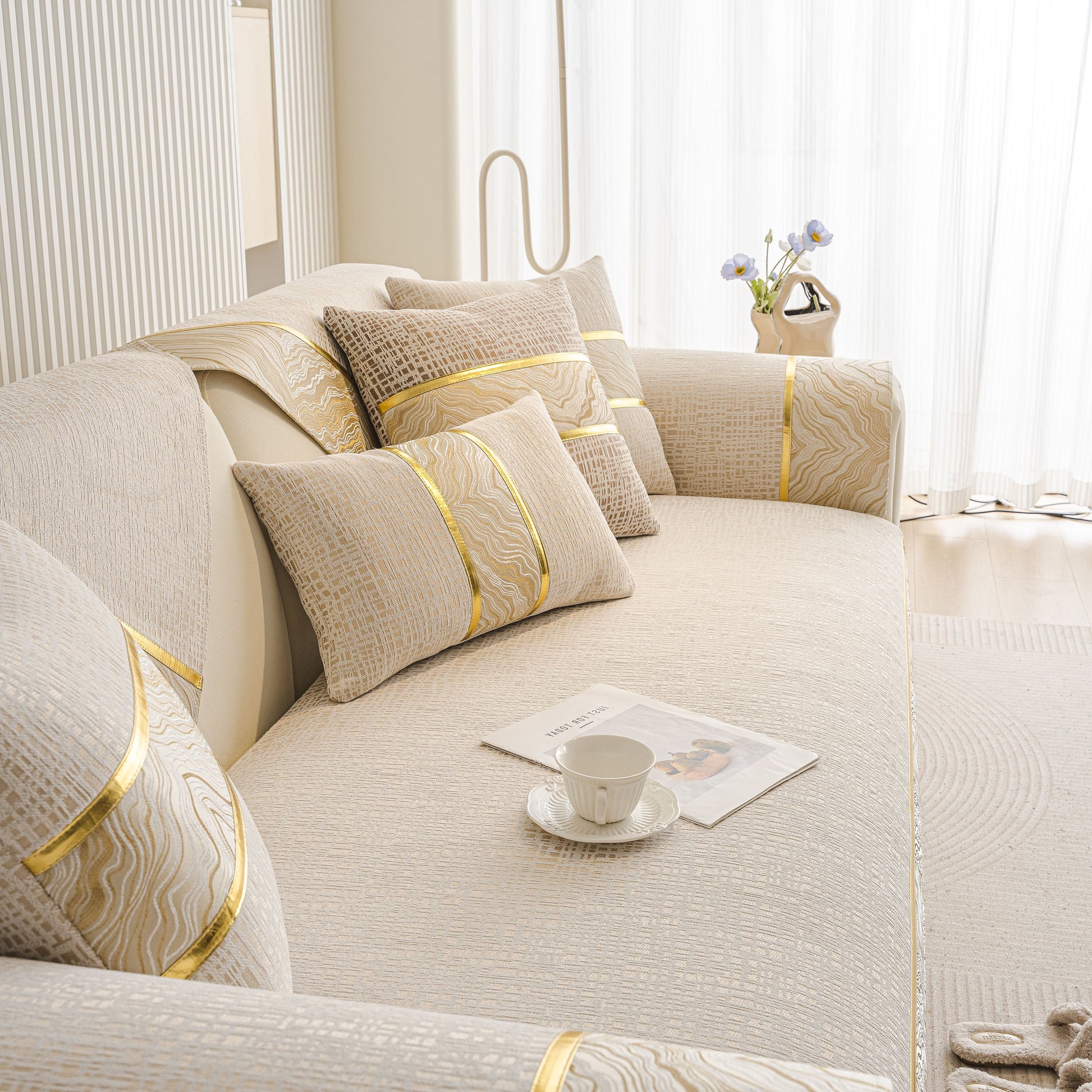 Modern Non-Slip Couch Slipcover, Soft, Durable & Washable Furniture Protector on a sofa with flowing gold marble-style trim.