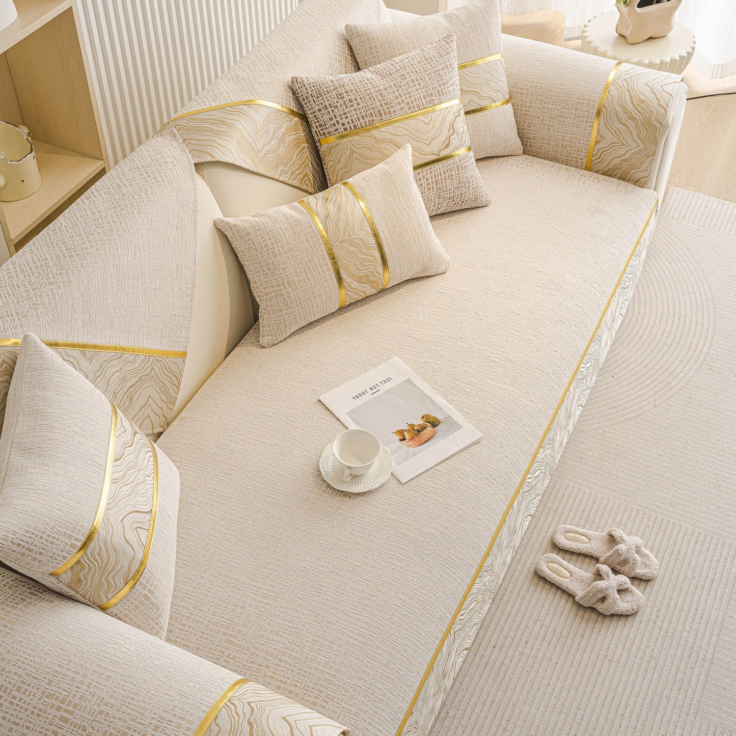 Modern Non-Slip Couch Slipcover, Soft, Durable & Washable Furniture Protector with gold marble-style trim on a chenille sofa