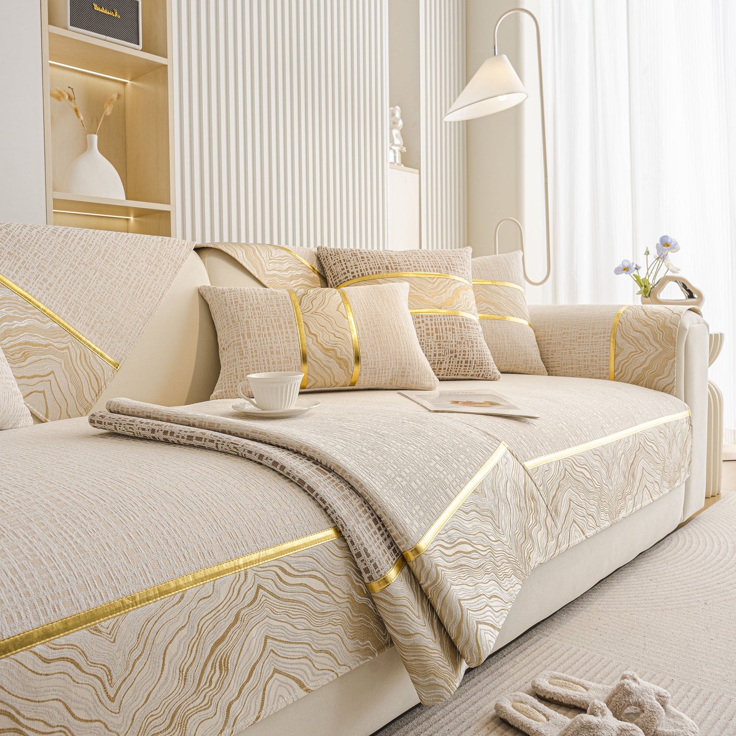Modern Non-Slip Couch Slipcover, Soft, Durable & Washable Furniture Protector with gold marble trim on sofa.