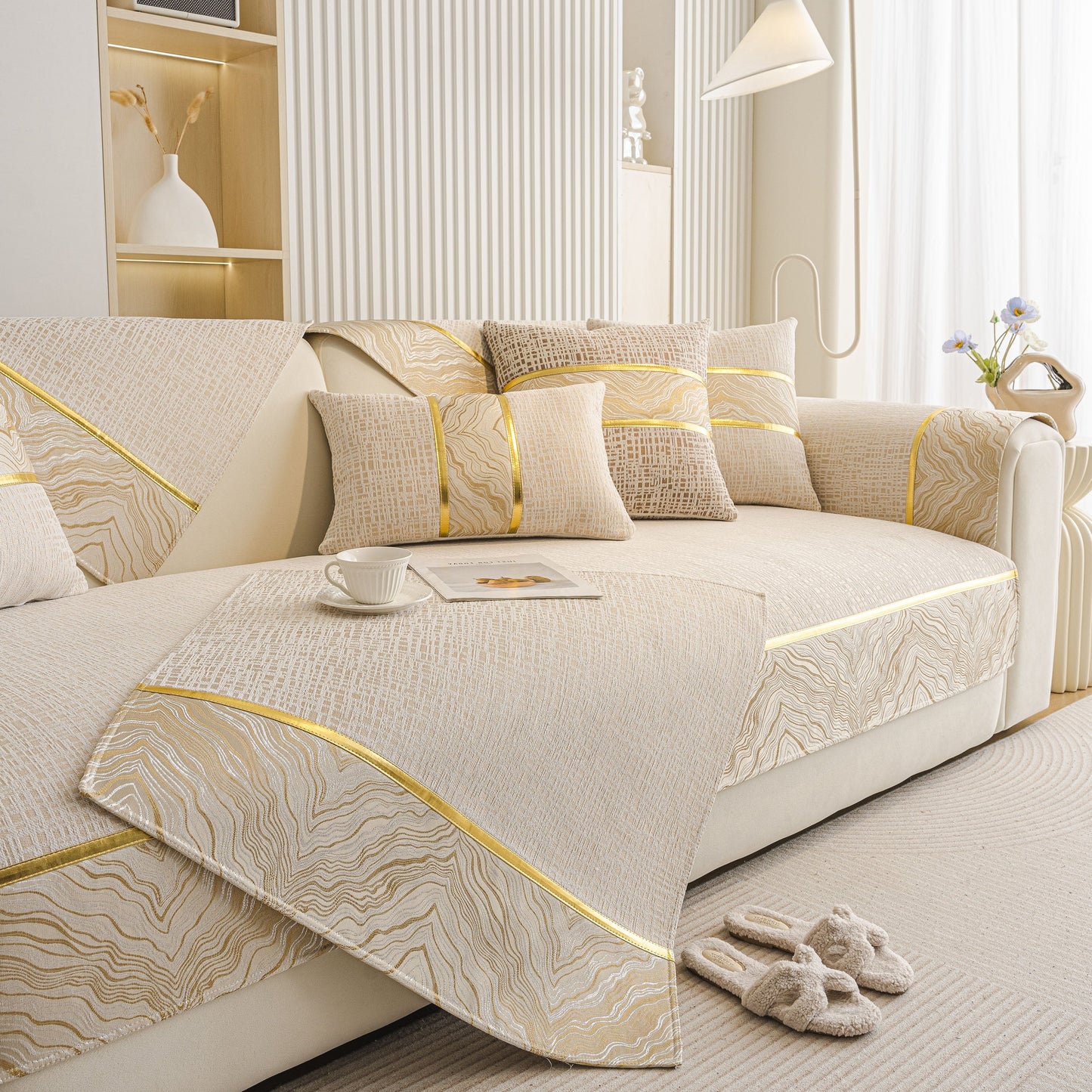 Modern Non-Slip Couch Slipcover, Soft, Durable & Washable Furniture Protector with gold marble-style trim on a beige sofa.