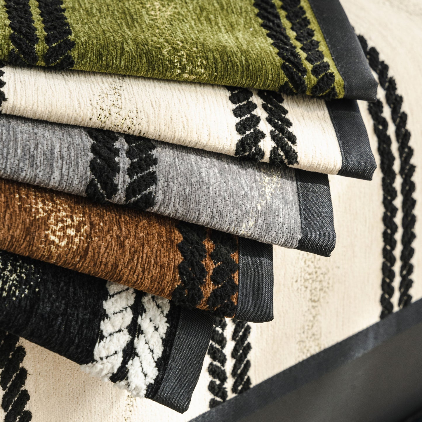Non-Slip Sofa Cover with Thick Chenille Texture Woven Stripe Couch Protector Throw showcasing stacked fabric samples.