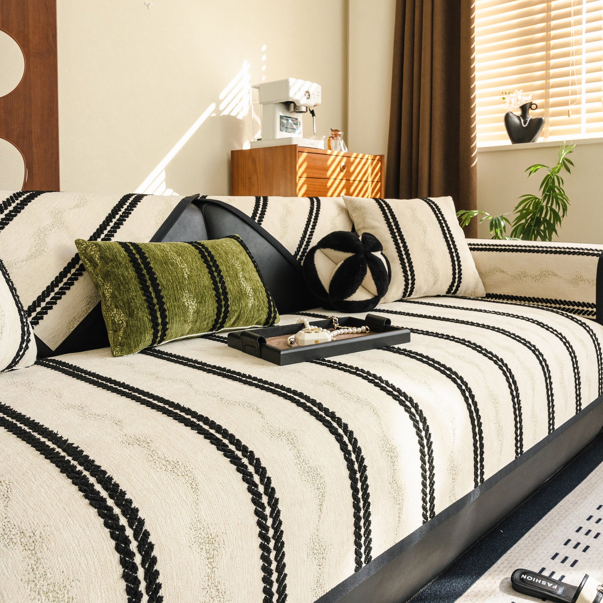 Non-Slip Sofa Cover with Thick Chenille Texture Woven Stripe Couch Protector Throw on a modern sofa in a cozy living room.
