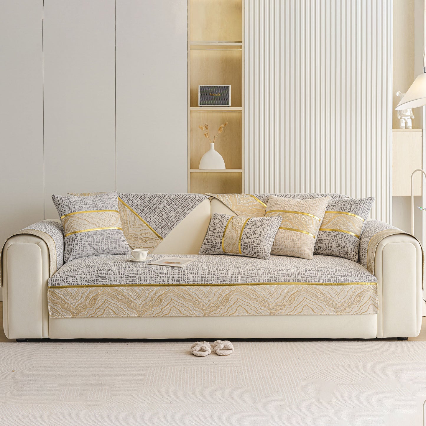 Modern Non-Slip Couch Slipcover, Soft, Durable & Washable Furniture Protector on a beige sofa with gold trim design.