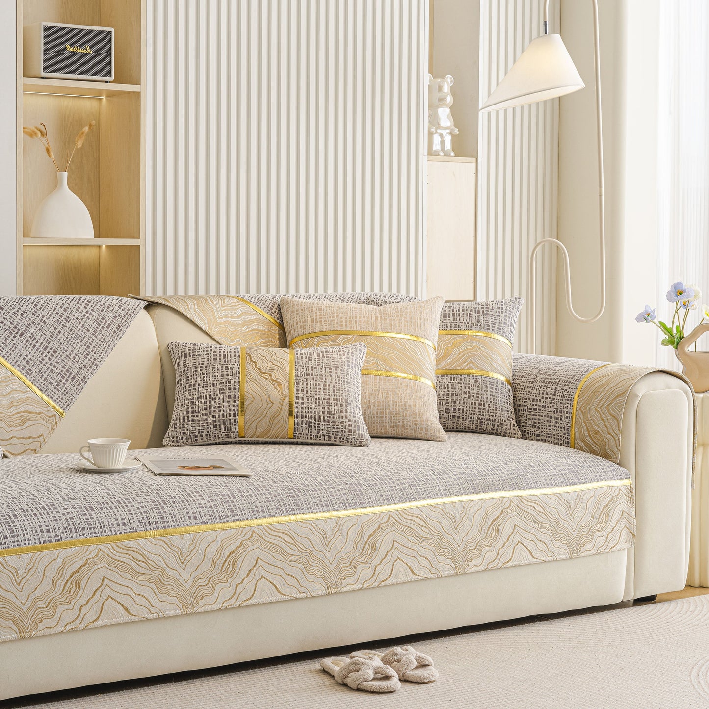 Modern Non-Slip Couch Slipcover, Soft, Durable & Washable Furniture Protector with gold marble trim on beige sofa in living room.