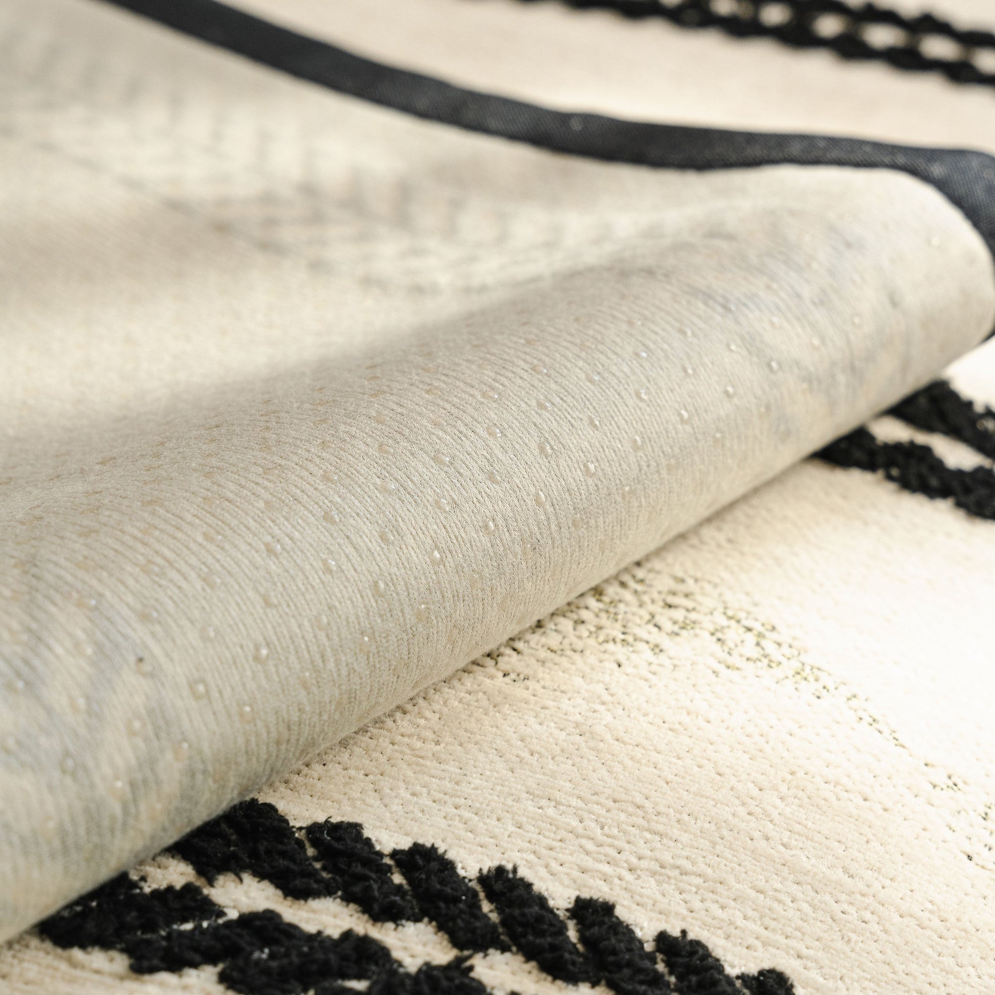Non-Slip Sofa Cover with Thick Chenille Texture Woven Stripe Couch Protector Throw showing anti-slip silicone backing and woven texture