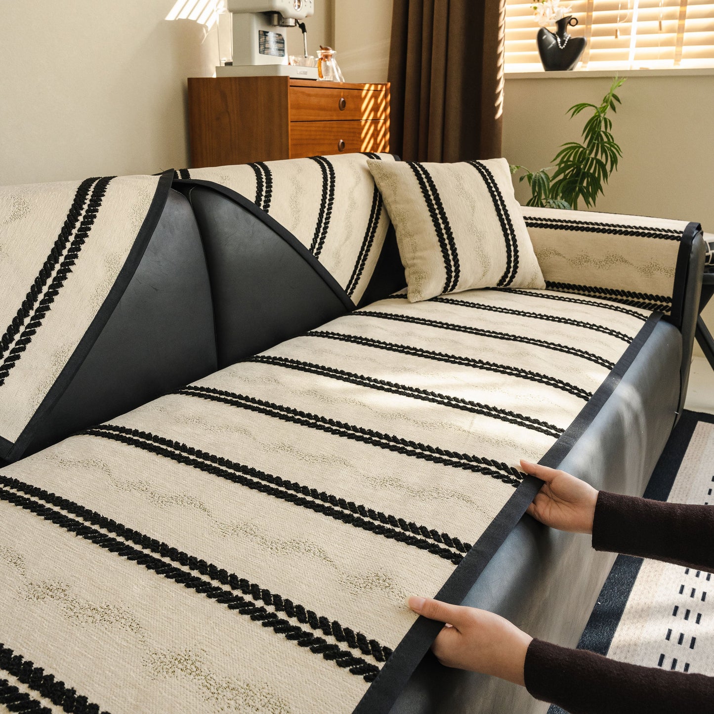 Non-Slip Sofa Cover with Thick Chenille Texture Woven Stripe Couch Protector Throw on a modern sofa in a living room setting