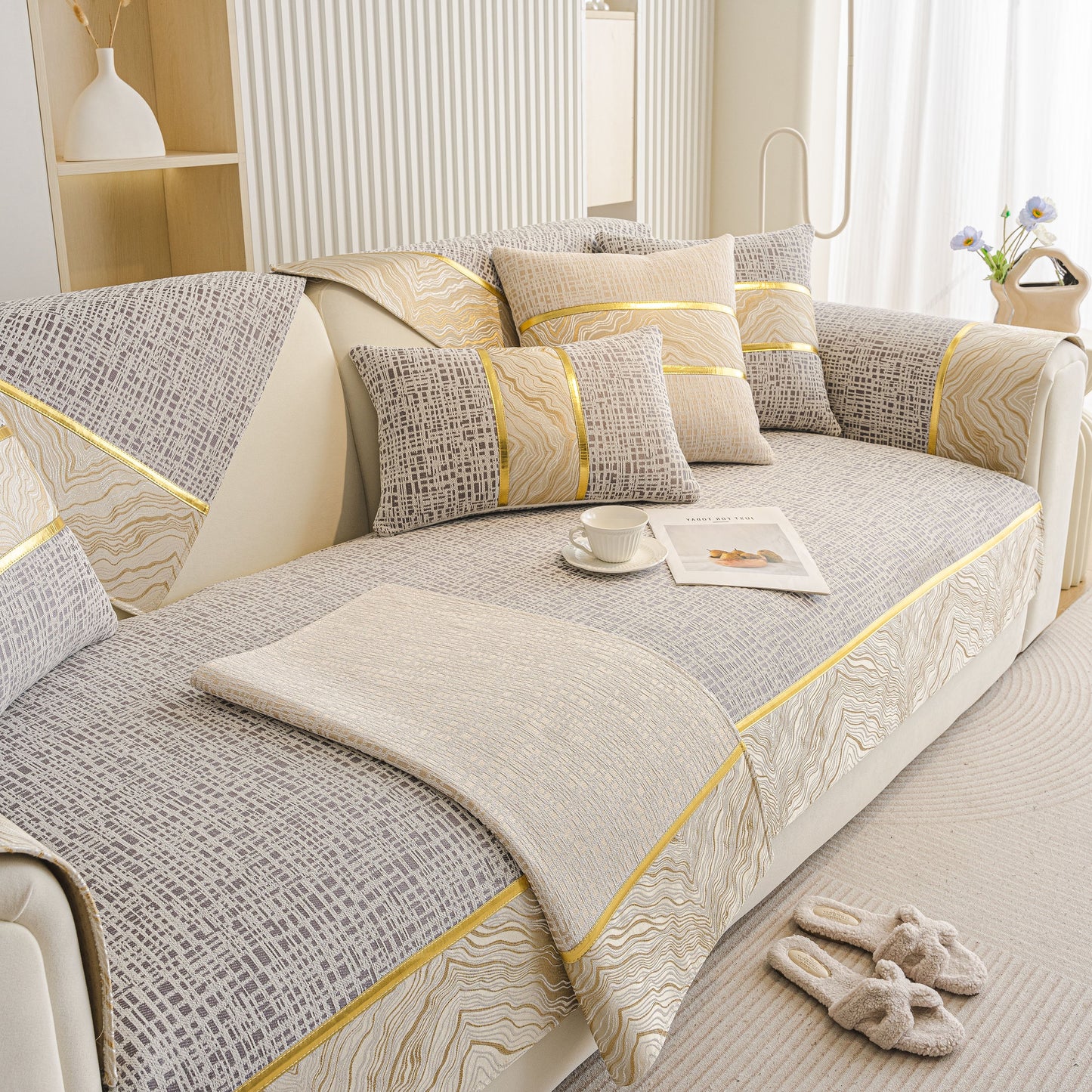 Modern Non-Slip Couch Slipcover, Soft, Durable & Washable Furniture Protector with gold marble-style trim on a beige sofa