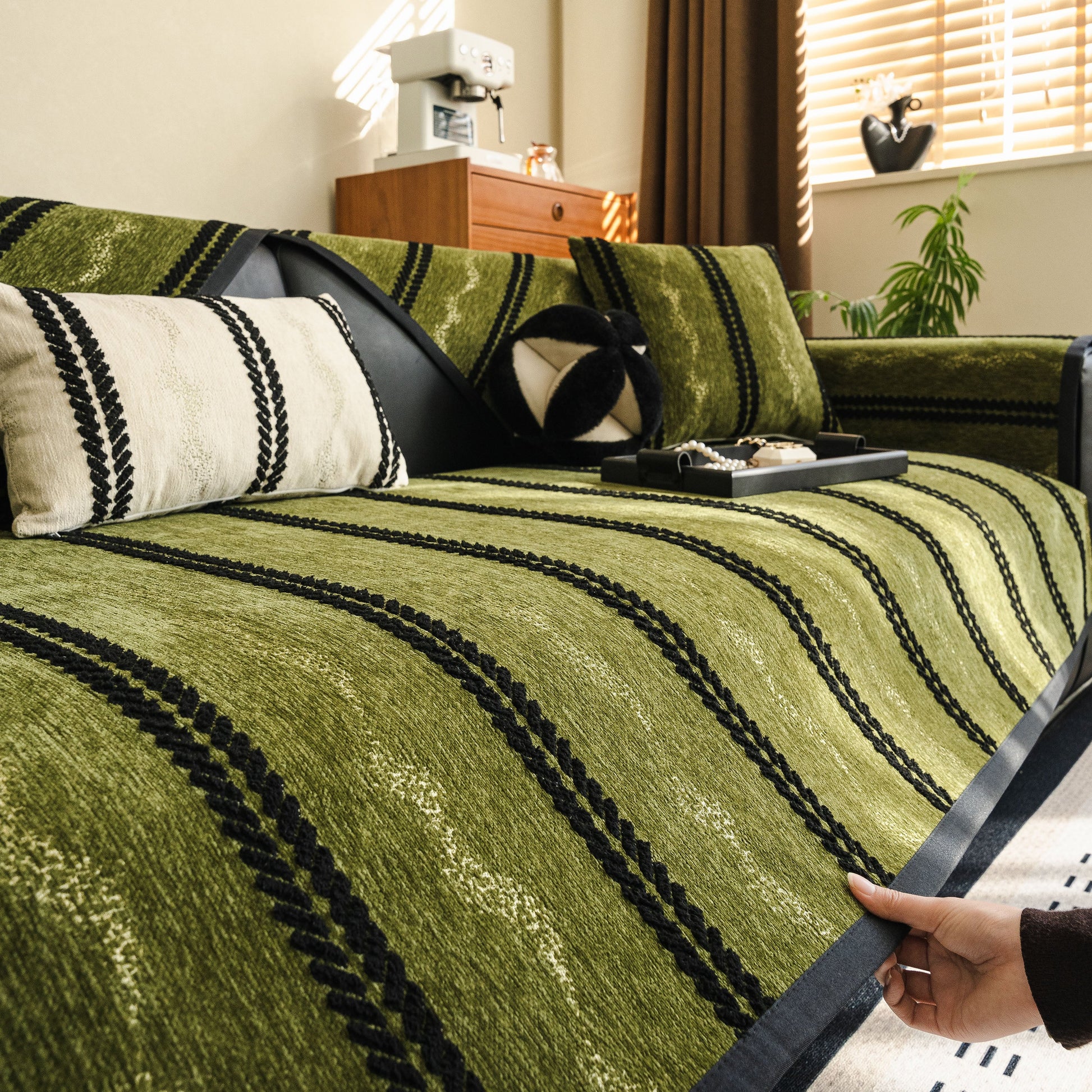 Non-Slip Sofa Cover with Thick Chenille Texture Woven Stripe Couch Protector Throw on green sofa with decorative pillows.