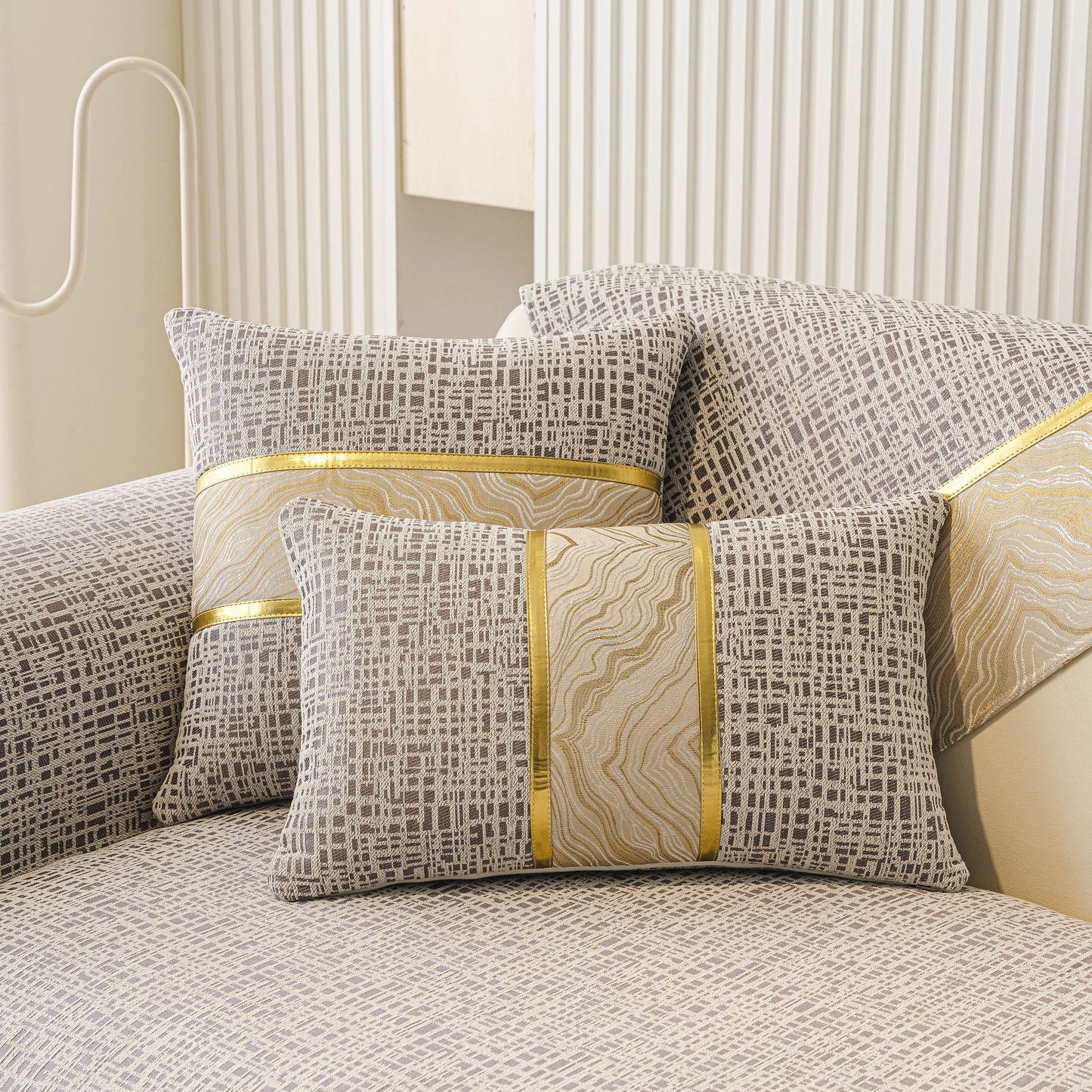 Modern Non-Slip Couch Slipcover, Soft, Durable & Washable Furniture Protector with gold marble-style trim on a chenille sofa.