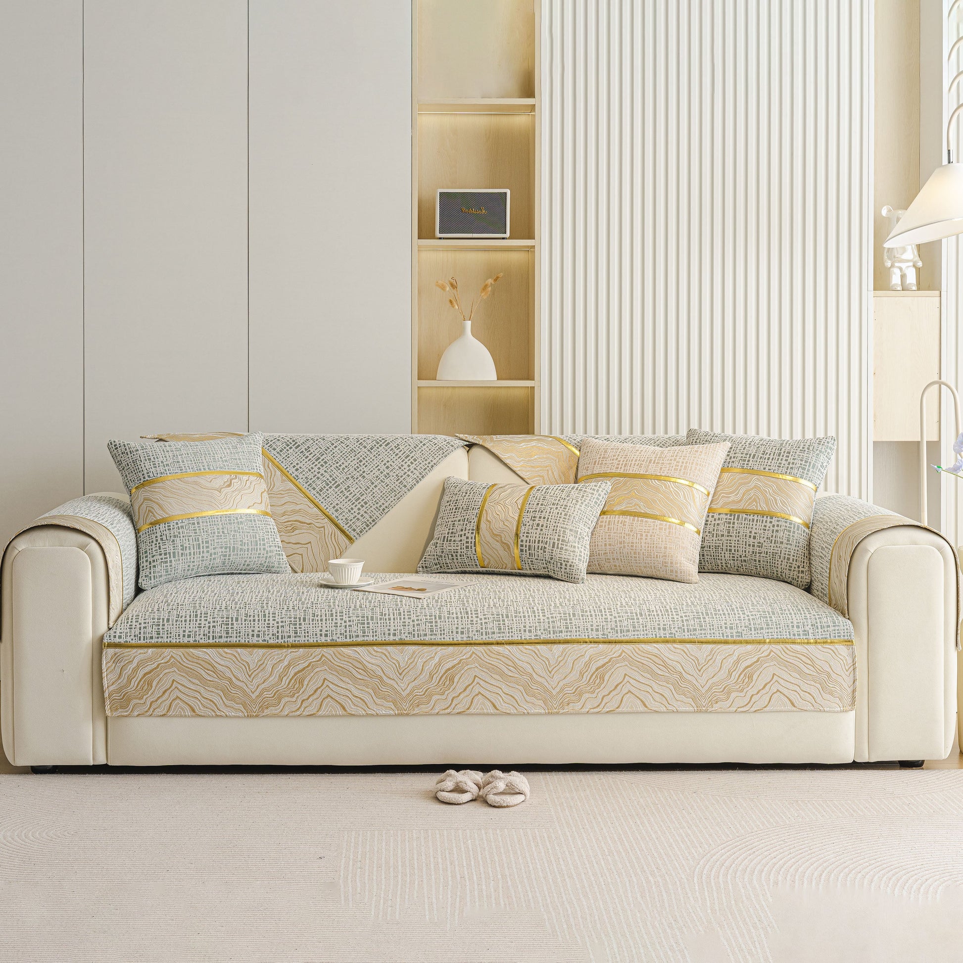 Modern Non-Slip Couch Slipcover, Soft, Durable & Washable Furniture Protector on a stylish sofa with elegant gold marble trim.