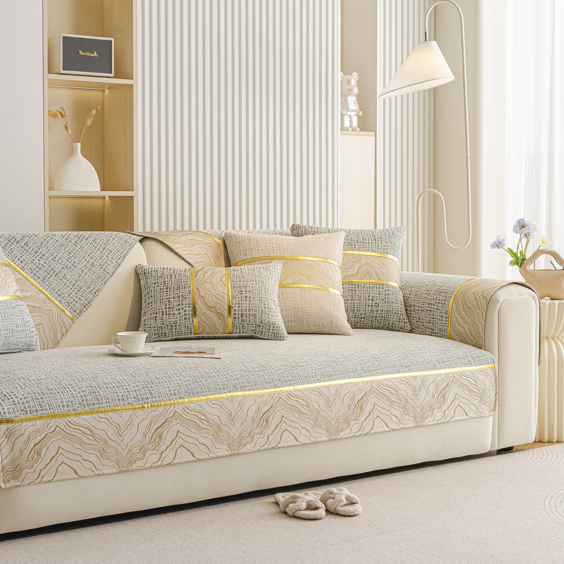 Modern Non-Slip Couch Slipcover, Soft, Durable & Washable Furniture Protector with chenille fabric and gold marble-style trim on a sofa