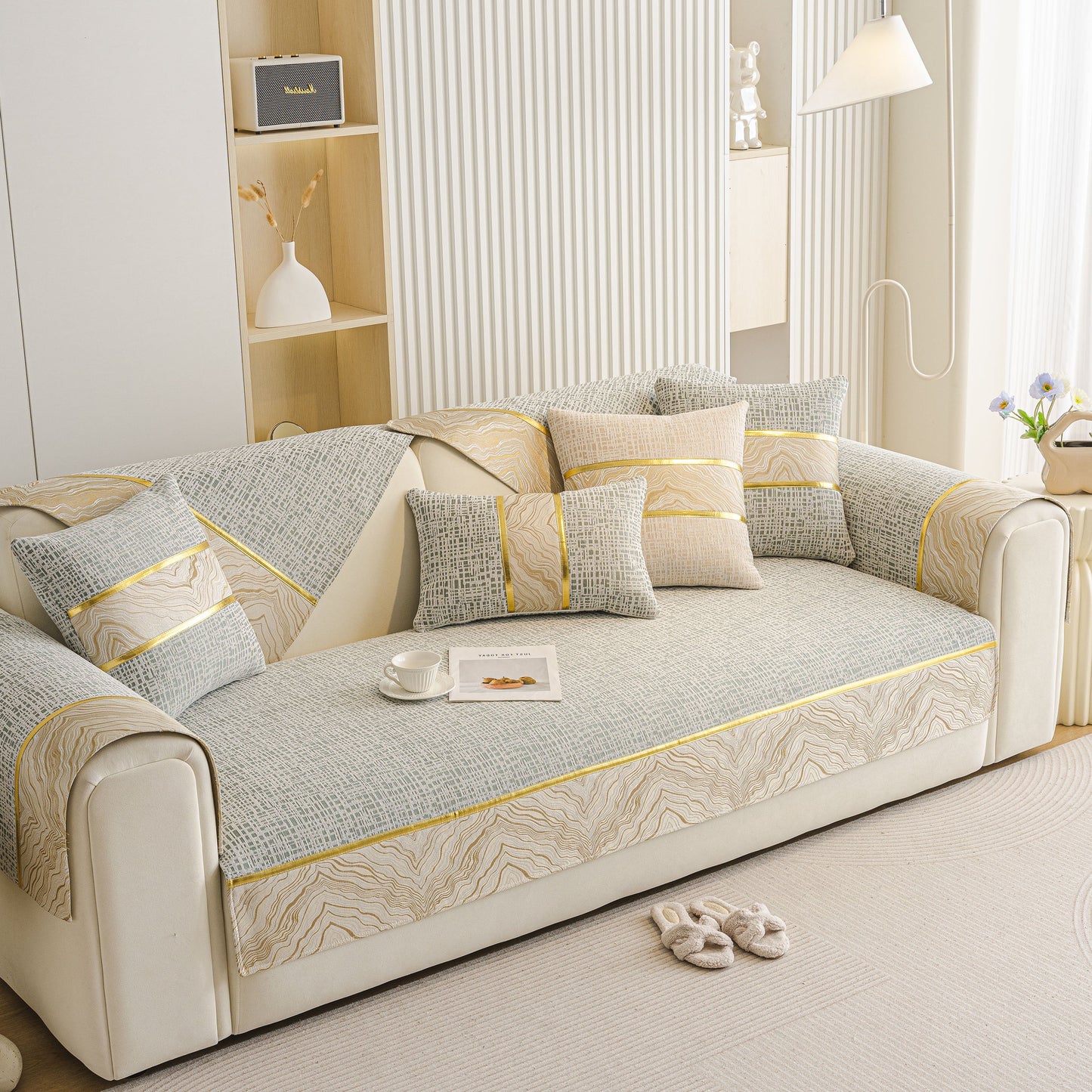 Modern Non-Slip Couch Slipcover, Soft, Durable & Washable Furniture Protector in a living room setting with gold marble trim.