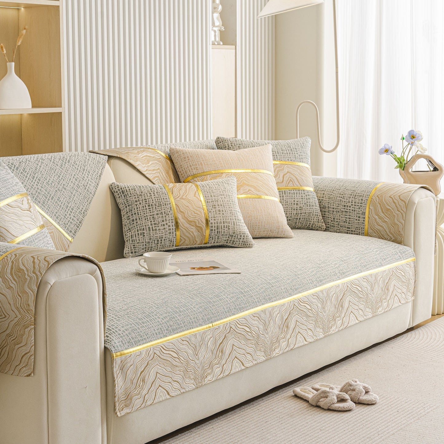 Modern Non-Slip Couch Slipcover, Soft, Durable & Washable Furniture Protector with gold marble-style trim on a beige sofa.