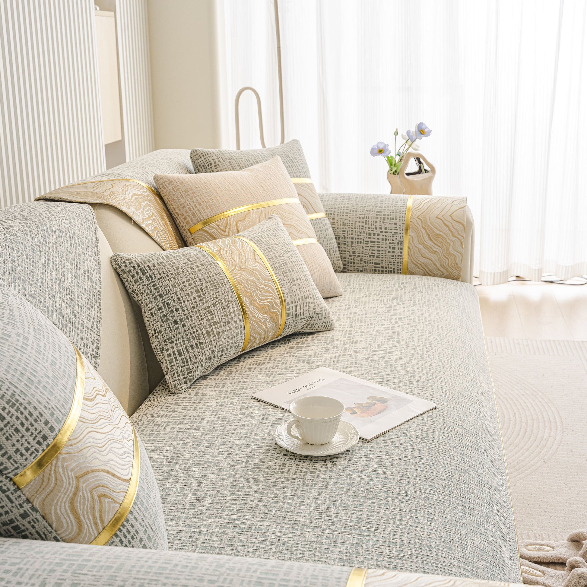 Modern Non-Slip Couch Slipcover, Soft, Durable & Washable Furniture Protector with gold marble-style trim and chenille fabric.