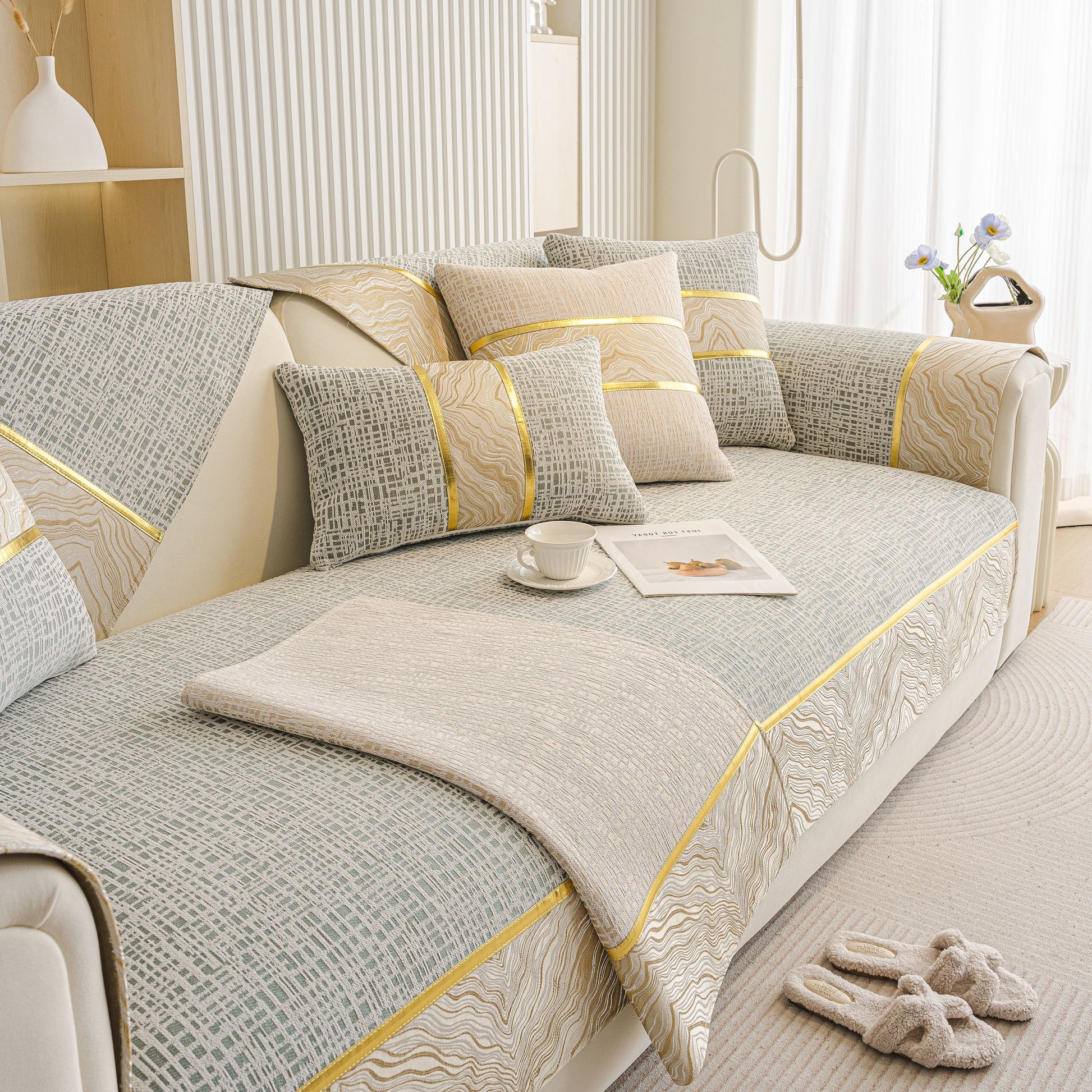 Modern Non-Slip Couch Slipcover, Soft, Durable & Washable Furniture Protector on a stylish sofa with gold marble-style trim.