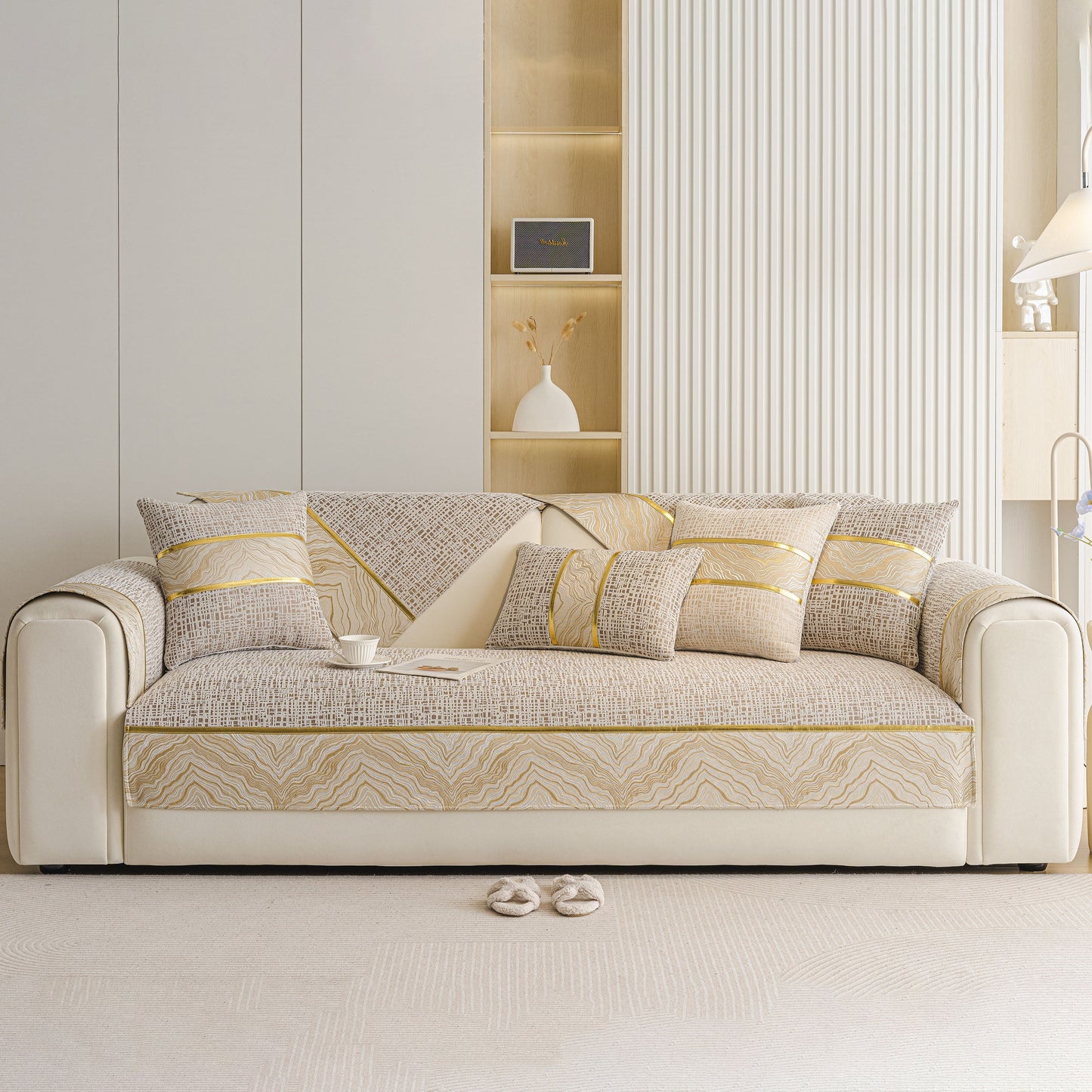 Modern Non-Slip Couch Slipcover, Soft, Durable & Washable Furniture Protector with gold marble-style trim on a sofa.