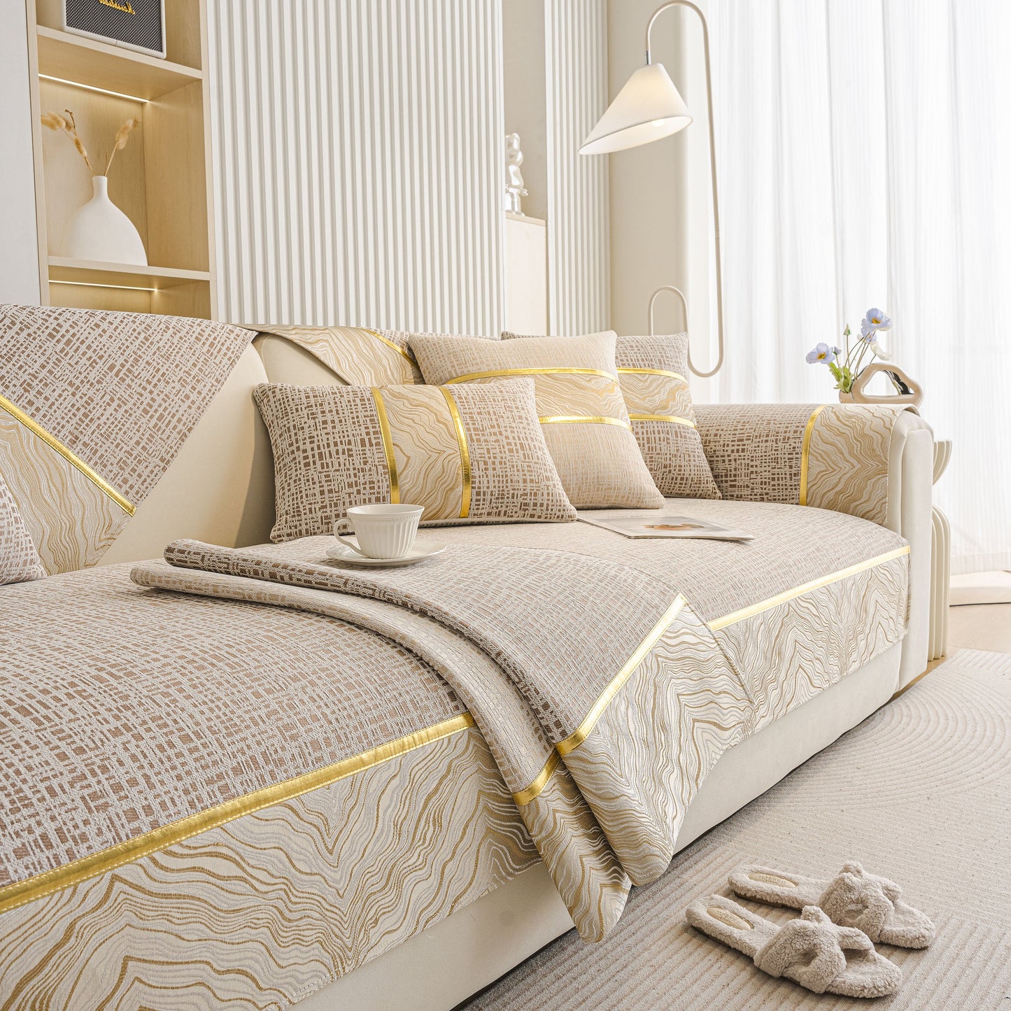 Modern Non-Slip Couch Slipcover, Soft, Durable & Washable Furniture Protector with gold marble-style trim on beige chenille fabric.