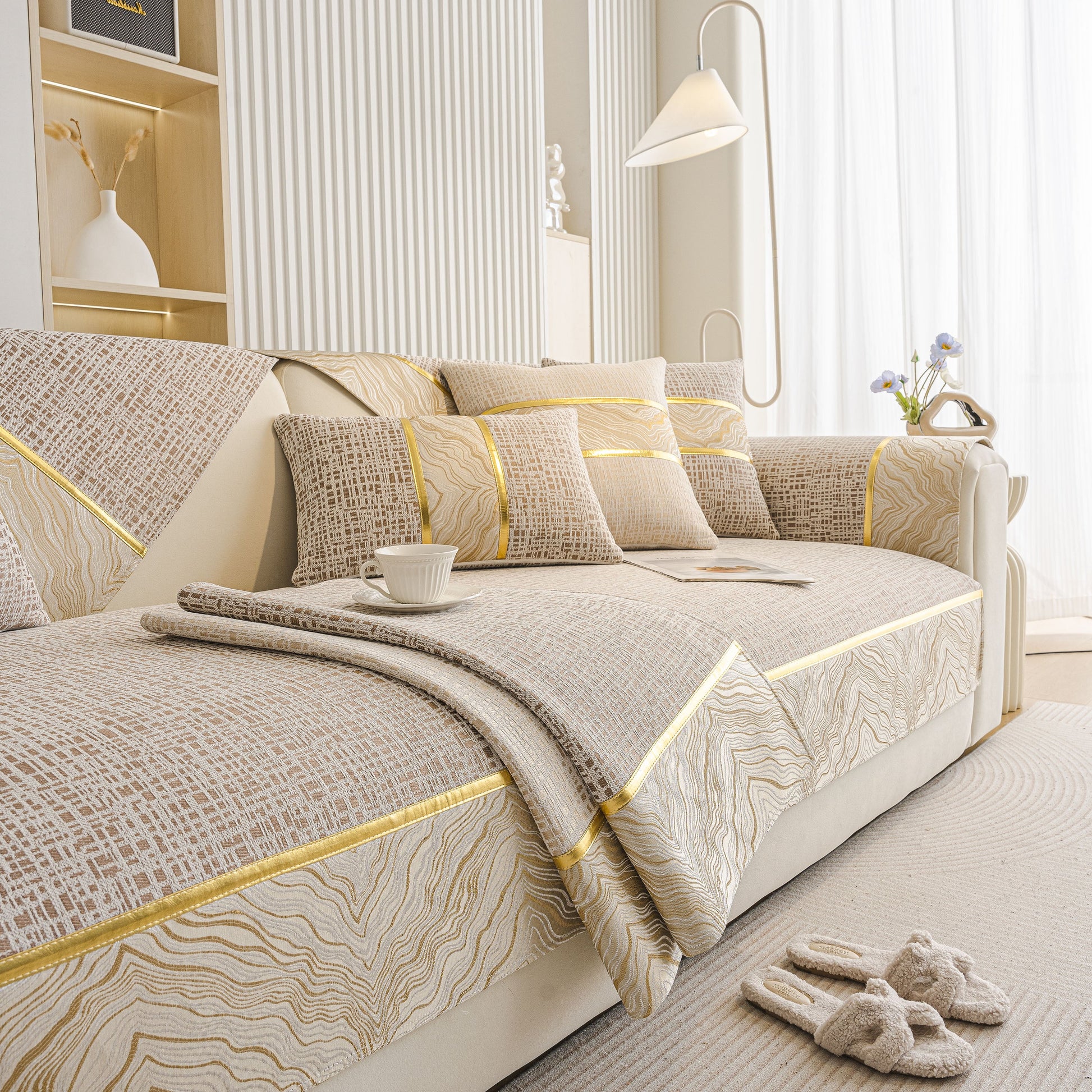 Modern Non-Slip Couch Slipcover, Soft, Durable & Washable Furniture Protector with gold marble-style trim on beige chenille fabric.