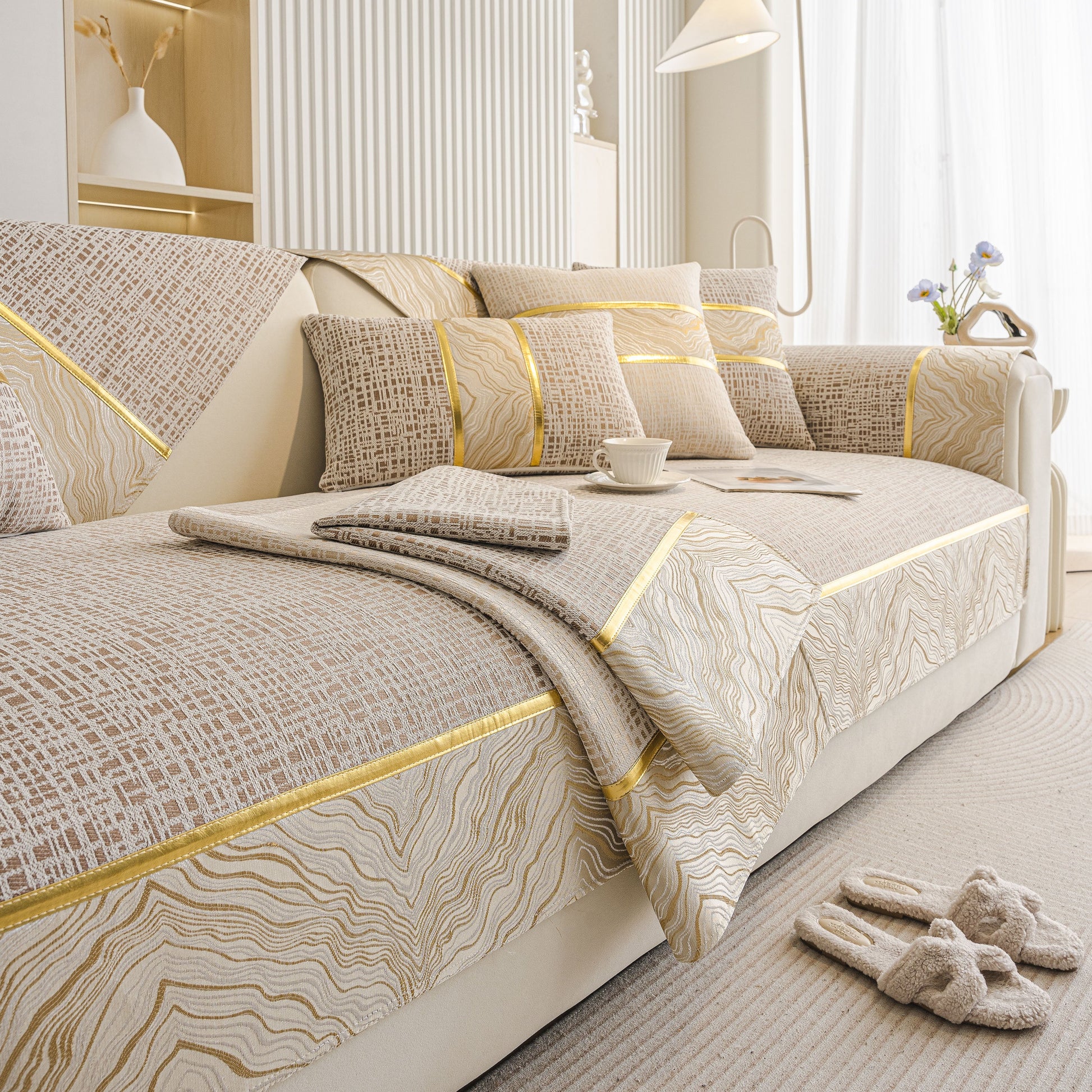 Modern Non-Slip Couch Slipcover, Soft, Durable & Washable Furniture Protector with gold marble trim on beige chenille fabric.