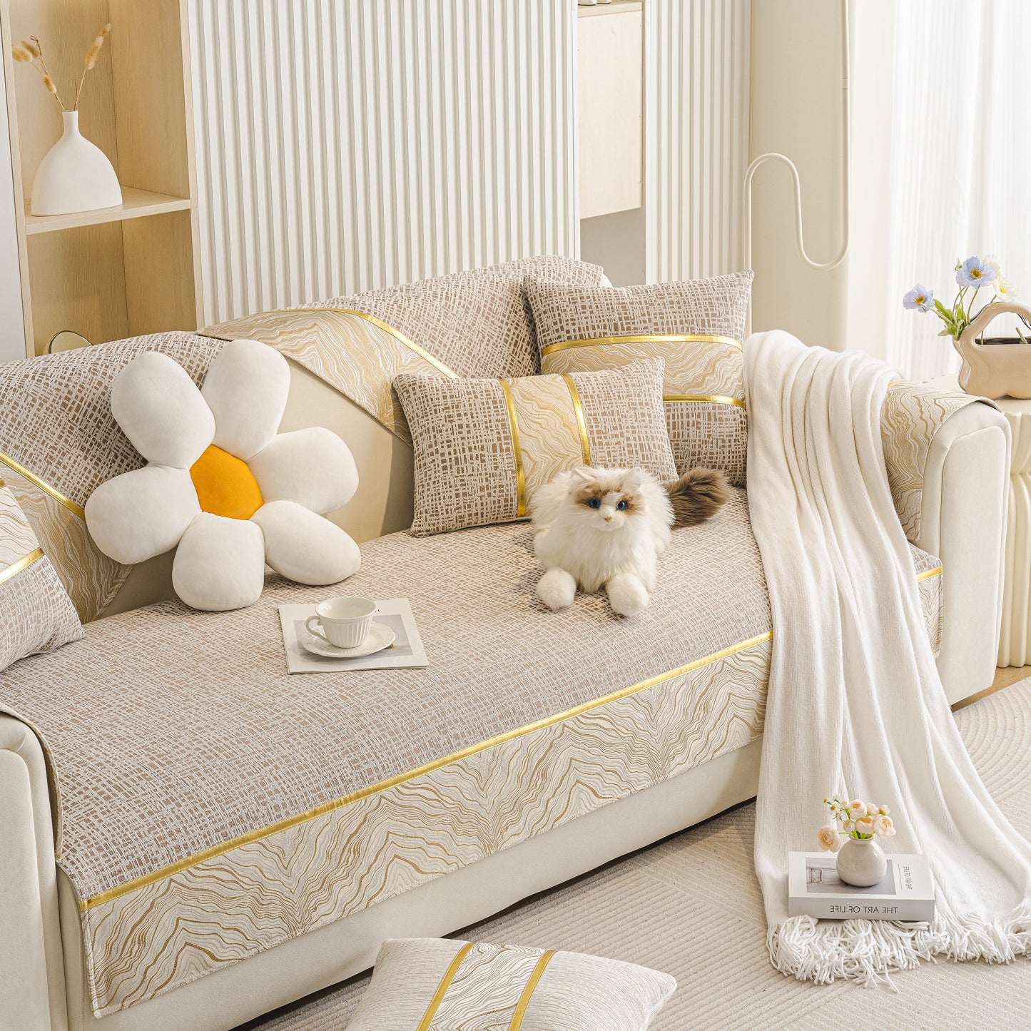 Modern Non-Slip Couch Slipcover, Soft, Durable & Washable Furniture Protector on a sofa with a chenille texture and gold marble trim.