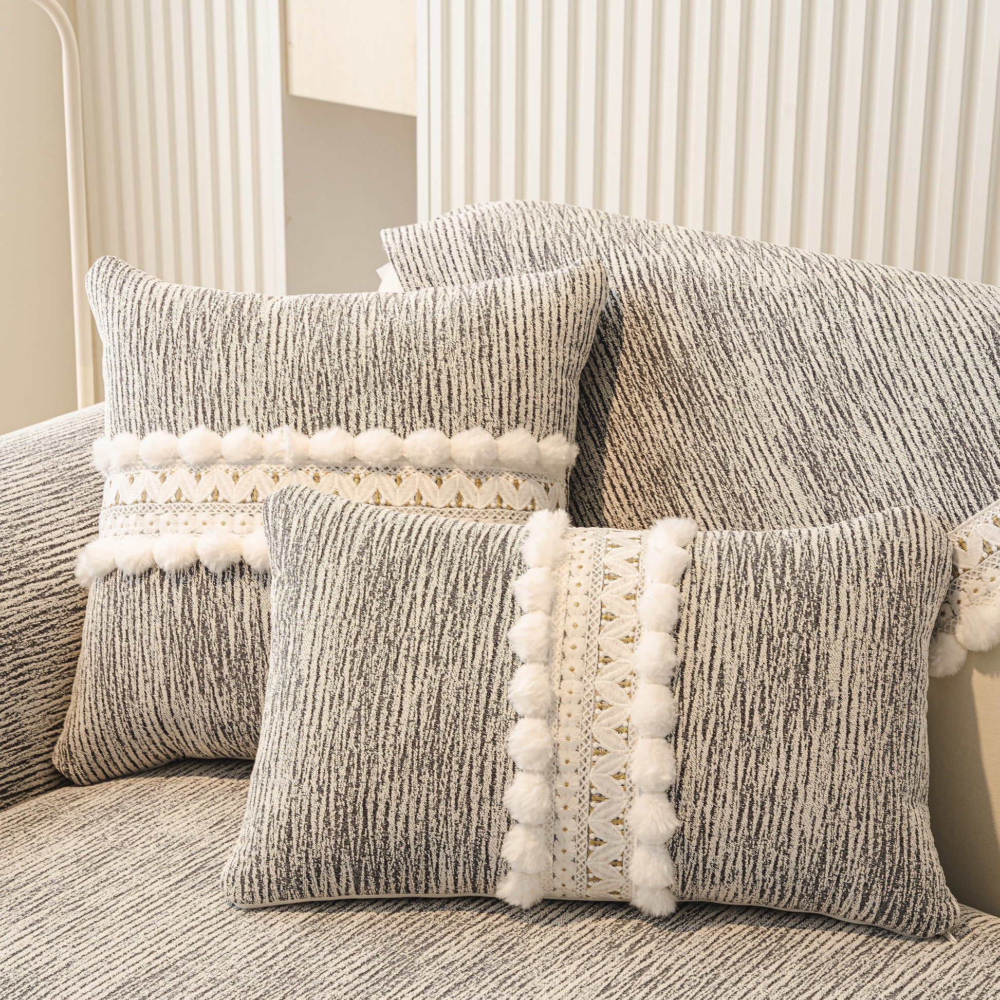 Soft Chenille Sectional Sofa Cover with Pom Pom Trim – Non-Slip Couch Protector in textured fabric with pom pom and lace accents.