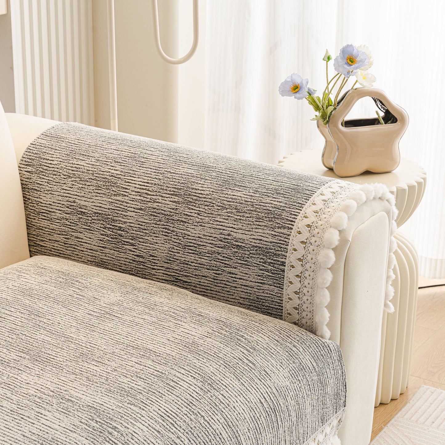 Soft Chenille Sectional Sofa Cover with Pom Pom Trim – Non-Slip Couch Protector in a modern interior setting
