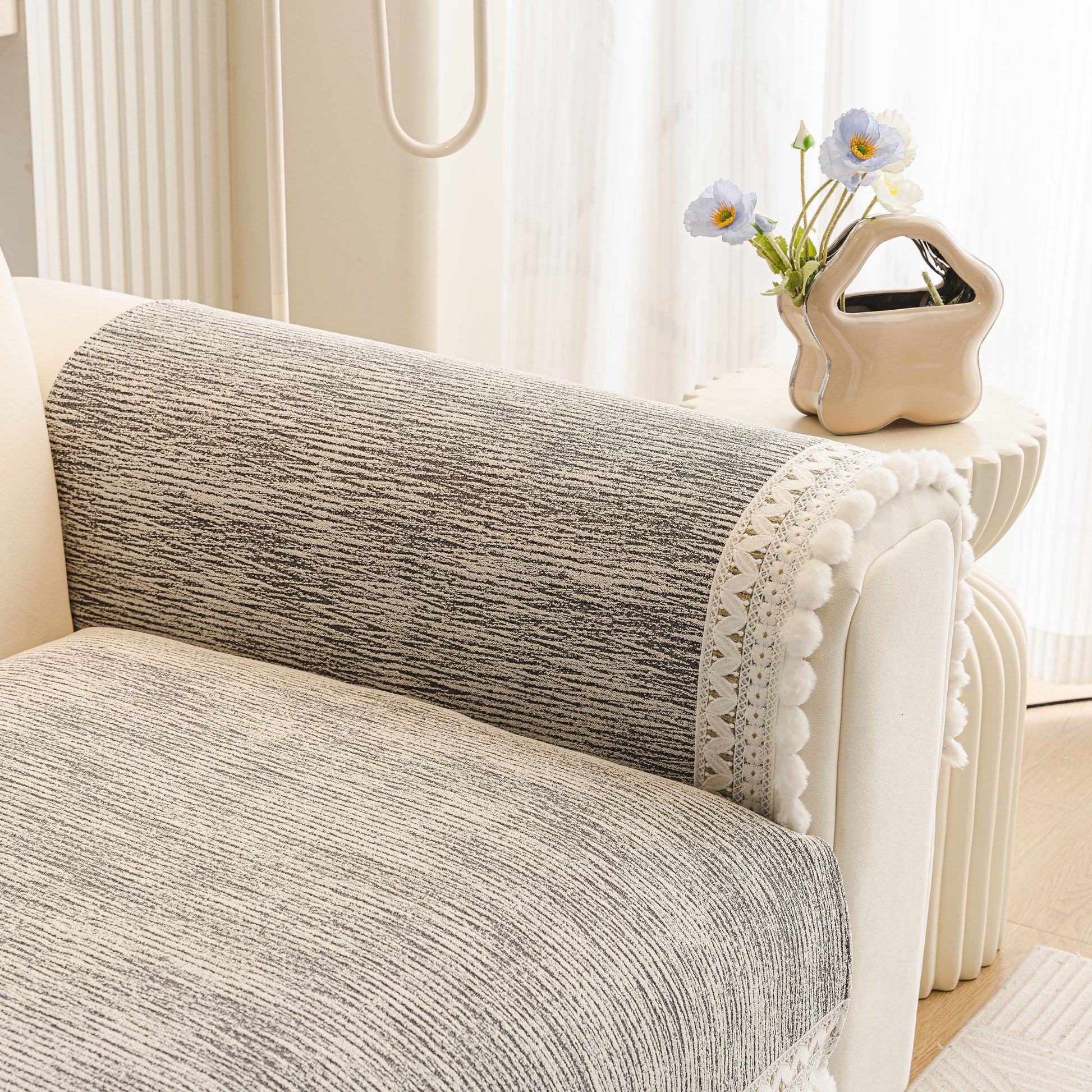 Soft Chenille Sectional Sofa Cover with Pom Pom Trim – Non-Slip Couch Protector in a modern interior setting