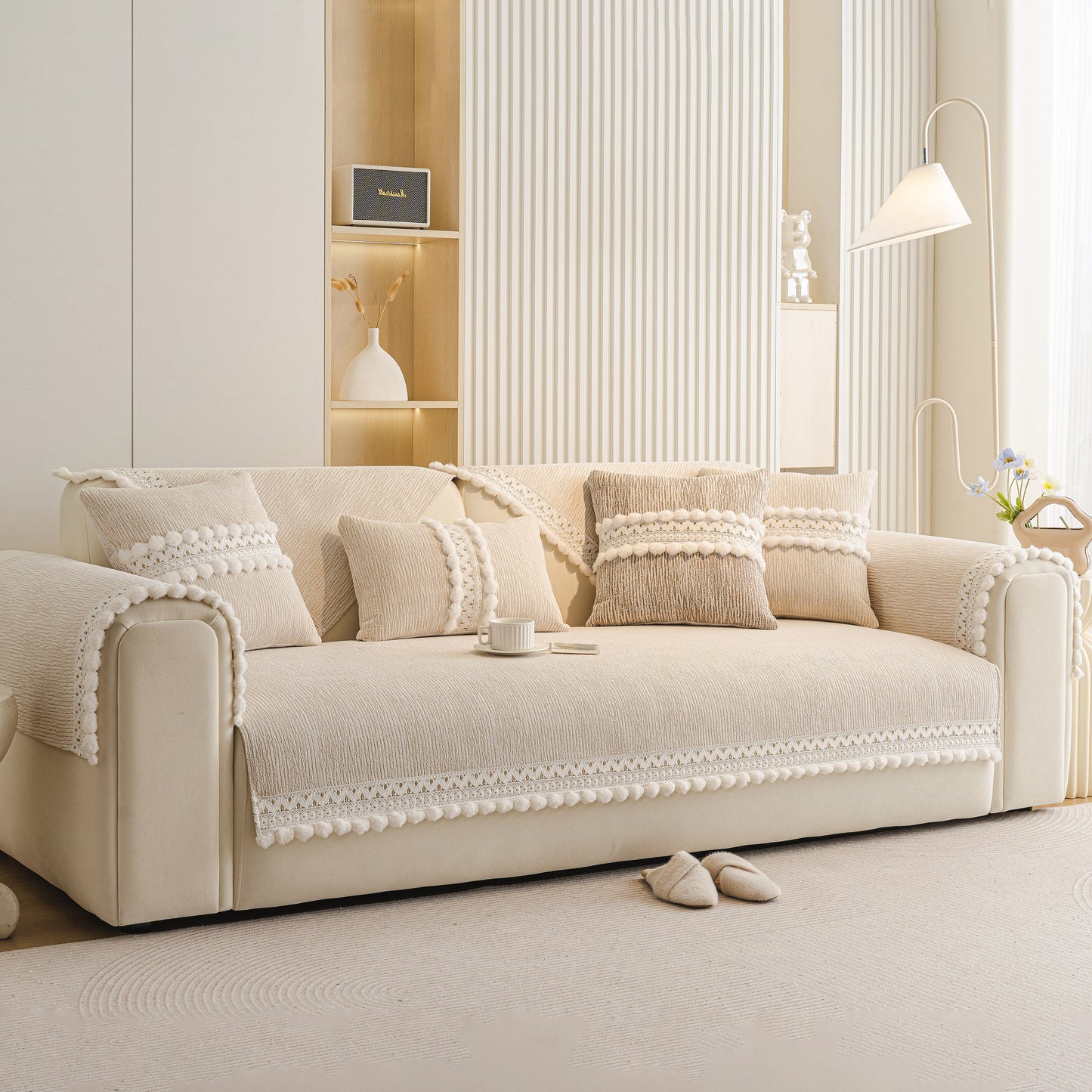 Soft Chenille Sectional Sofa Cover with Pom Pom Trim – Non-Slip Couch Protector on beige sofa with pillows