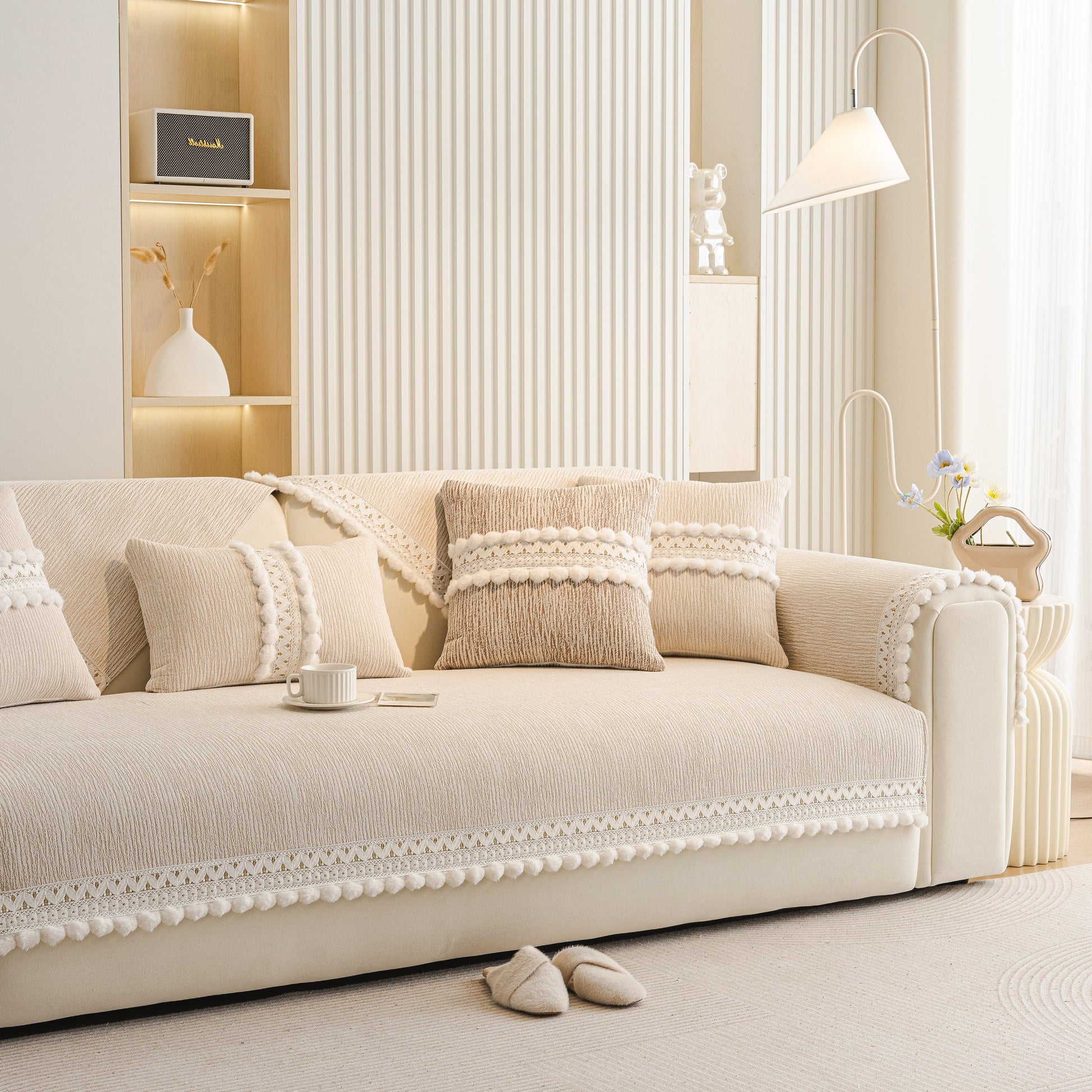 Stylish Soft Chenille Sectional Sofa Cover with Pom Pom Trim – Non-Slip Couch Protector in a modern living room setting.
