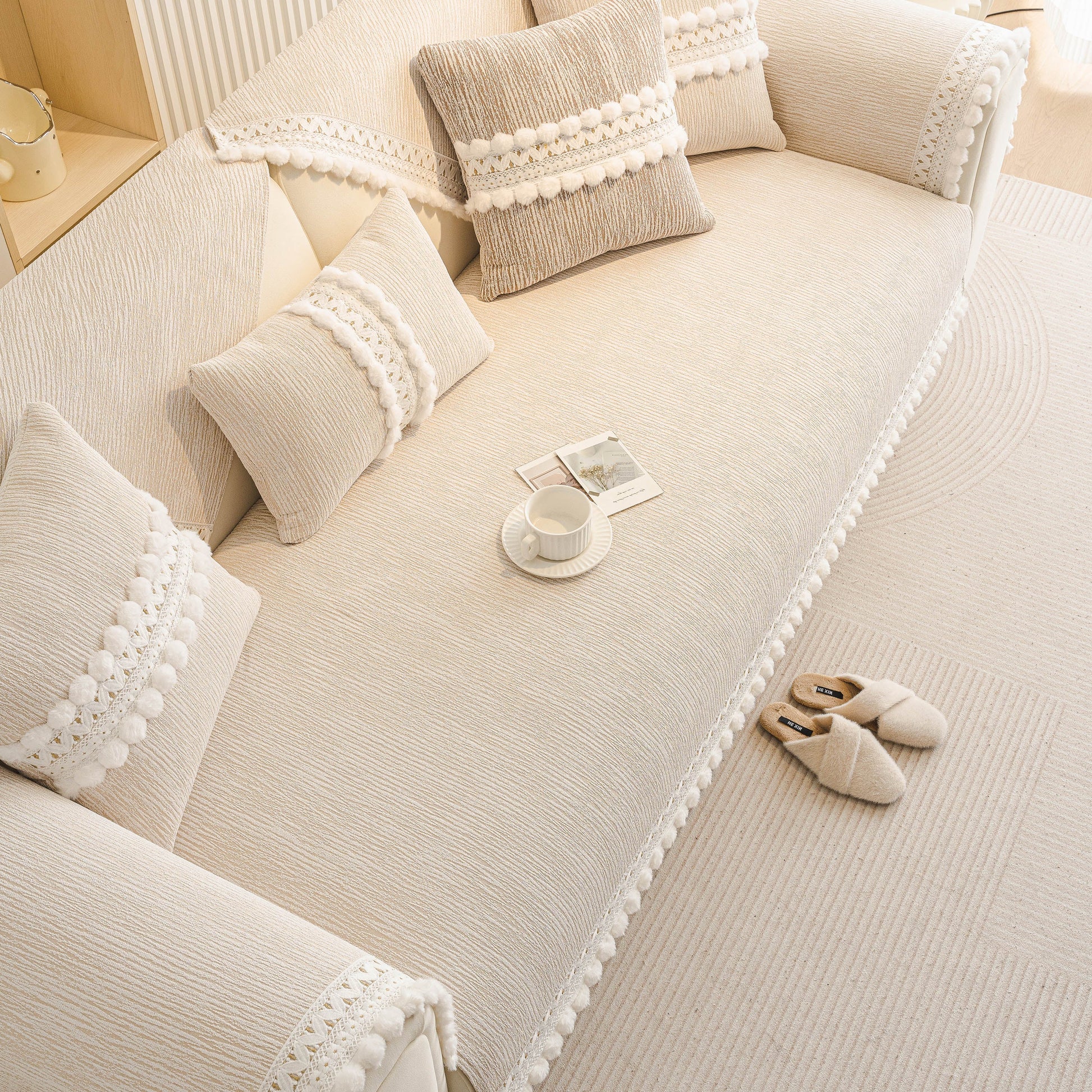 Soft Chenille Sectional Sofa Cover with Pom Pom Trim – Non-Slip Couch Protector in a modern living room setting.