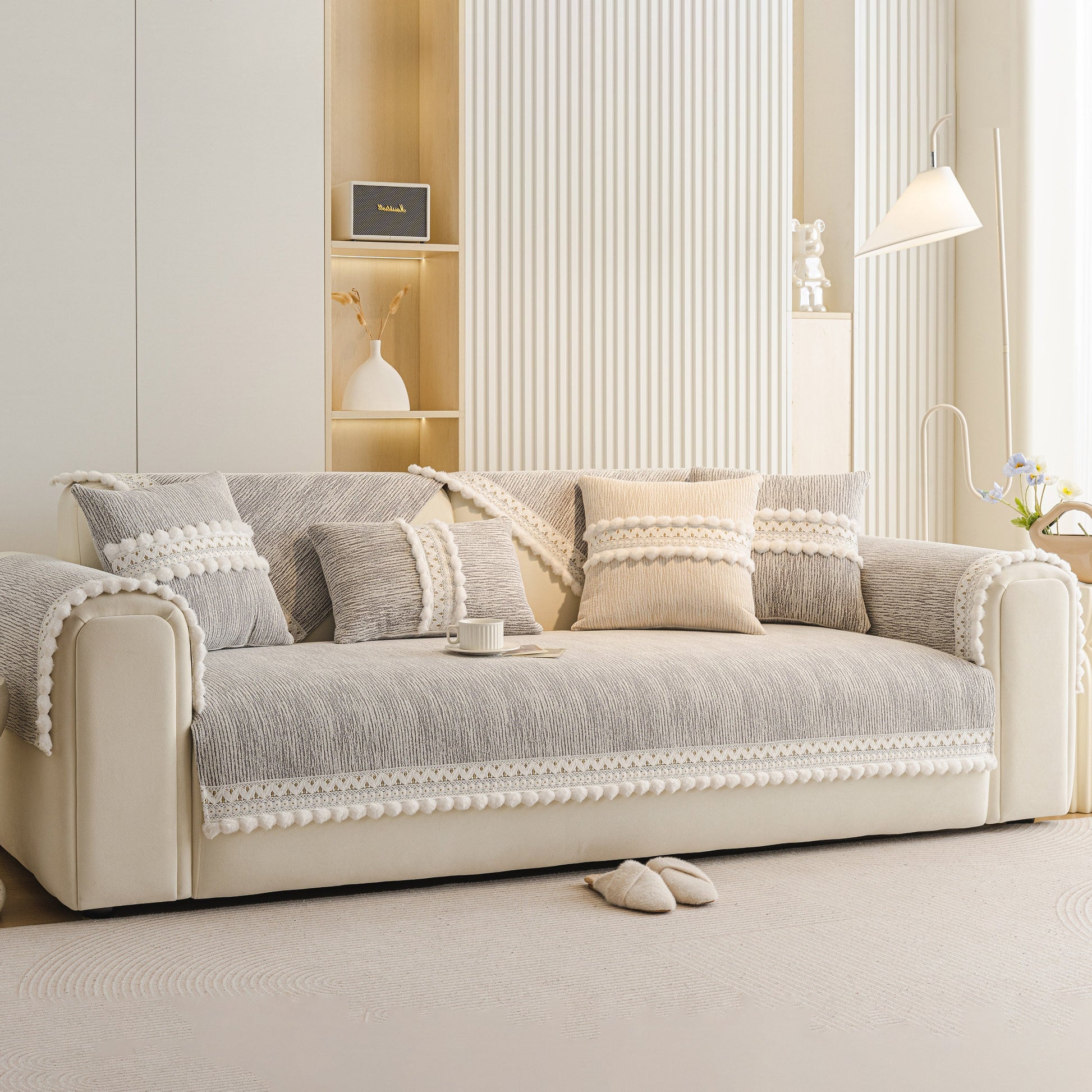 Soft Chenille Sectional Sofa Cover with Pom Pom Trim – Non-Slip Couch Protector on beige couch in modern living room