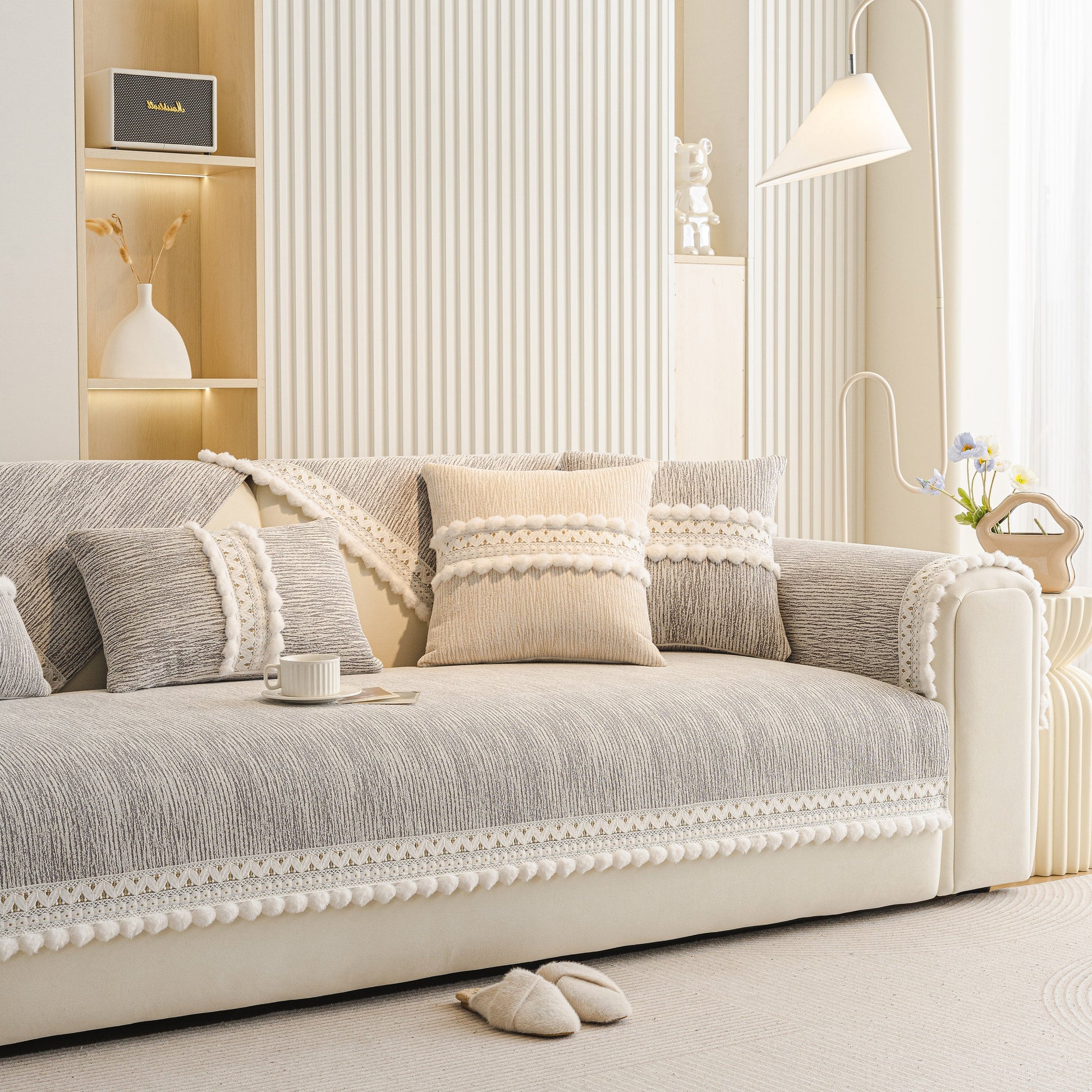 Soft Chenille Sectional Sofa Cover with Pom Pom Trim – Non-Slip Couch Protector on white sofa with decorative pillows.