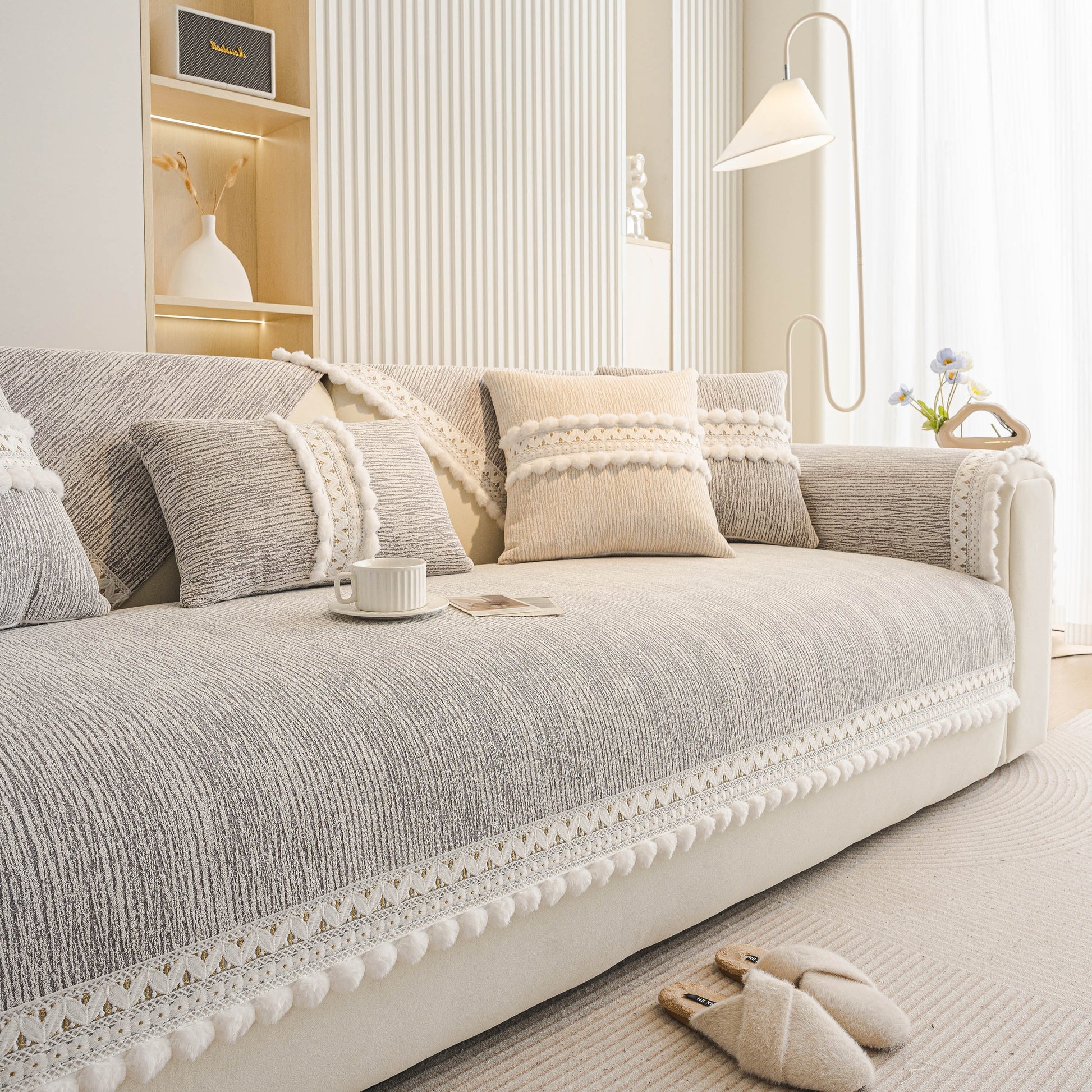 Soft Chenille Sectional Sofa Cover with Pom Pom Trim – Non-Slip Couch Protector in a modern living room setting.