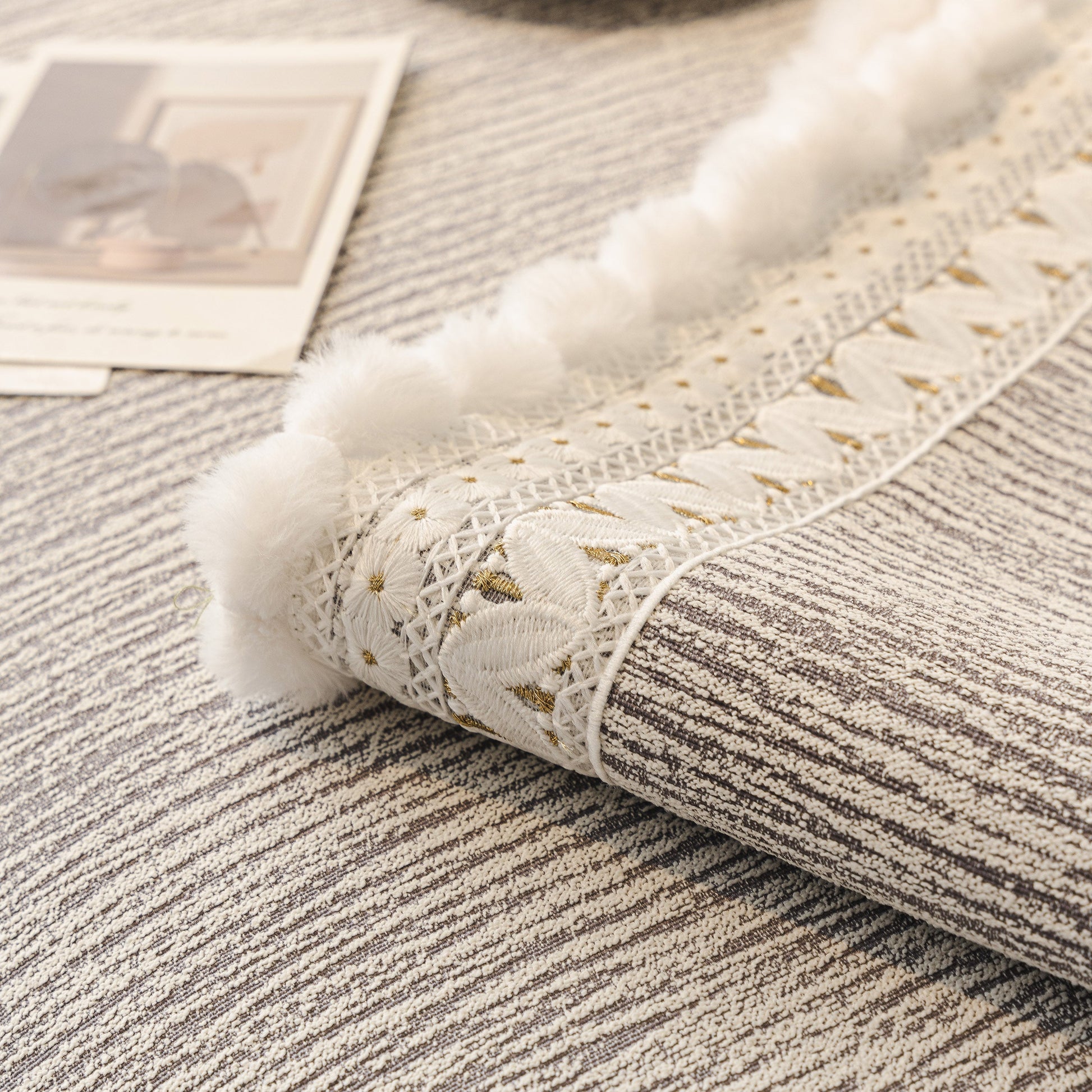 Soft Chenille Sectional Sofa Cover with Pom Pom Trim – Non-Slip Couch Protector detail, showing texture and pom pom fringe.