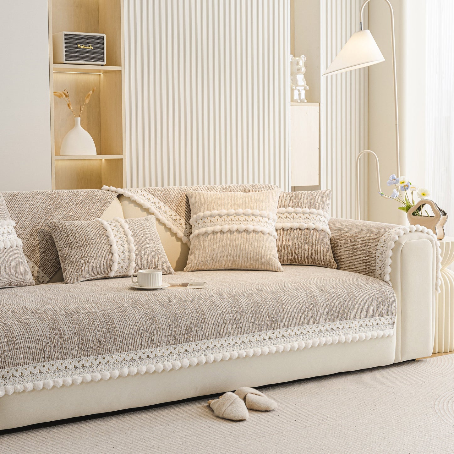 Soft Chenille Sectional Sofa Cover with Pom Pom Trim – Non-Slip Couch Protector on beige sofa with decorative pillows.