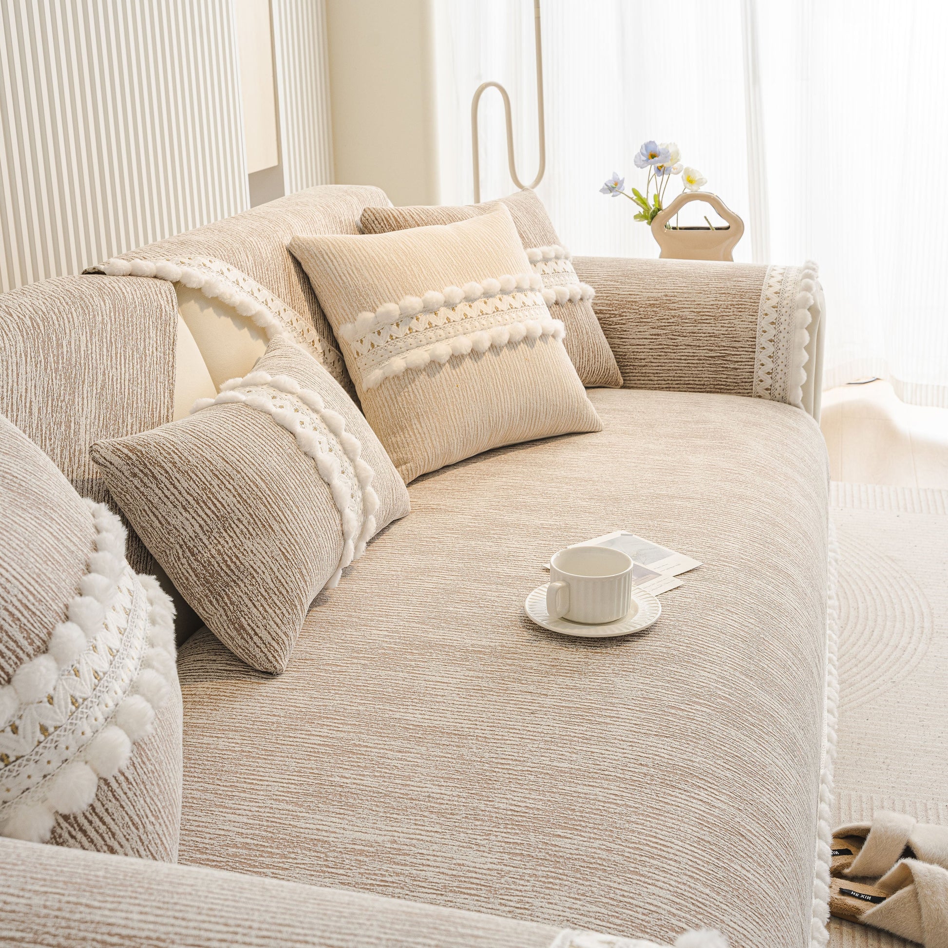 Soft Chenille Sectional Sofa Cover with Pom Pom Trim – Non-Slip Couch Protector in a modern living room setting