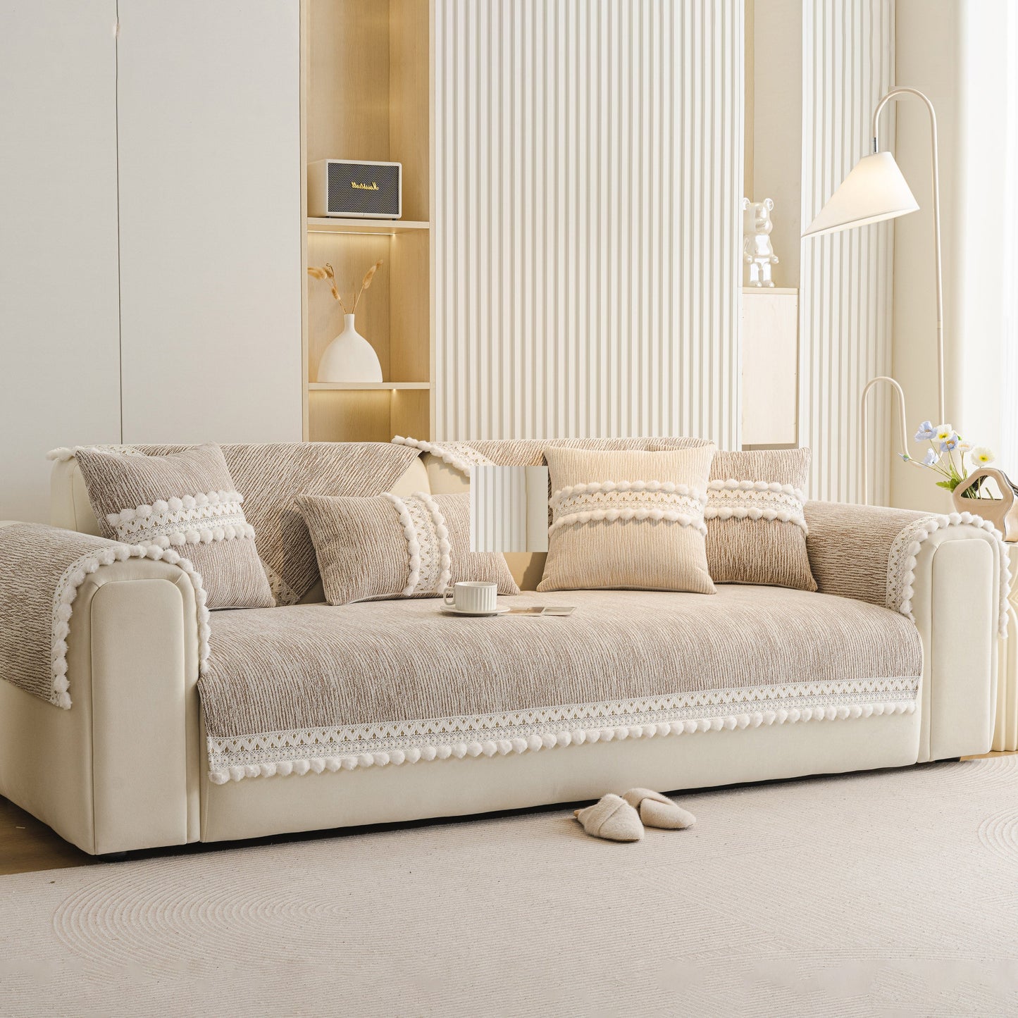 Soft Chenille Sectional Sofa Cover with Pom Pom Trim – Non-Slip Couch Protector in a modern living room with cushions.