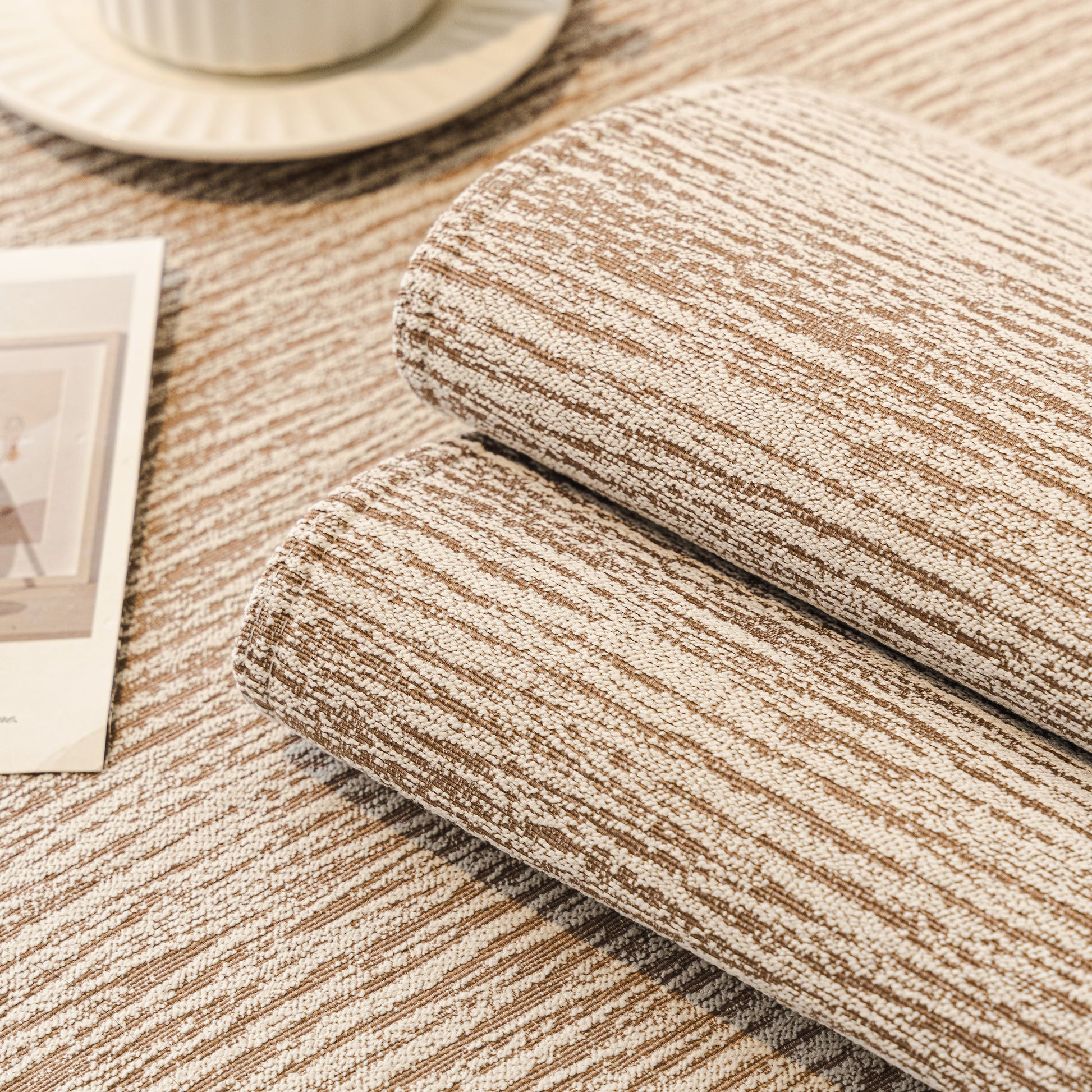 Soft Chenille Sectional Sofa Cover with Pom Pom Trim – Non-Slip Couch Protector displayed on a textured surface.