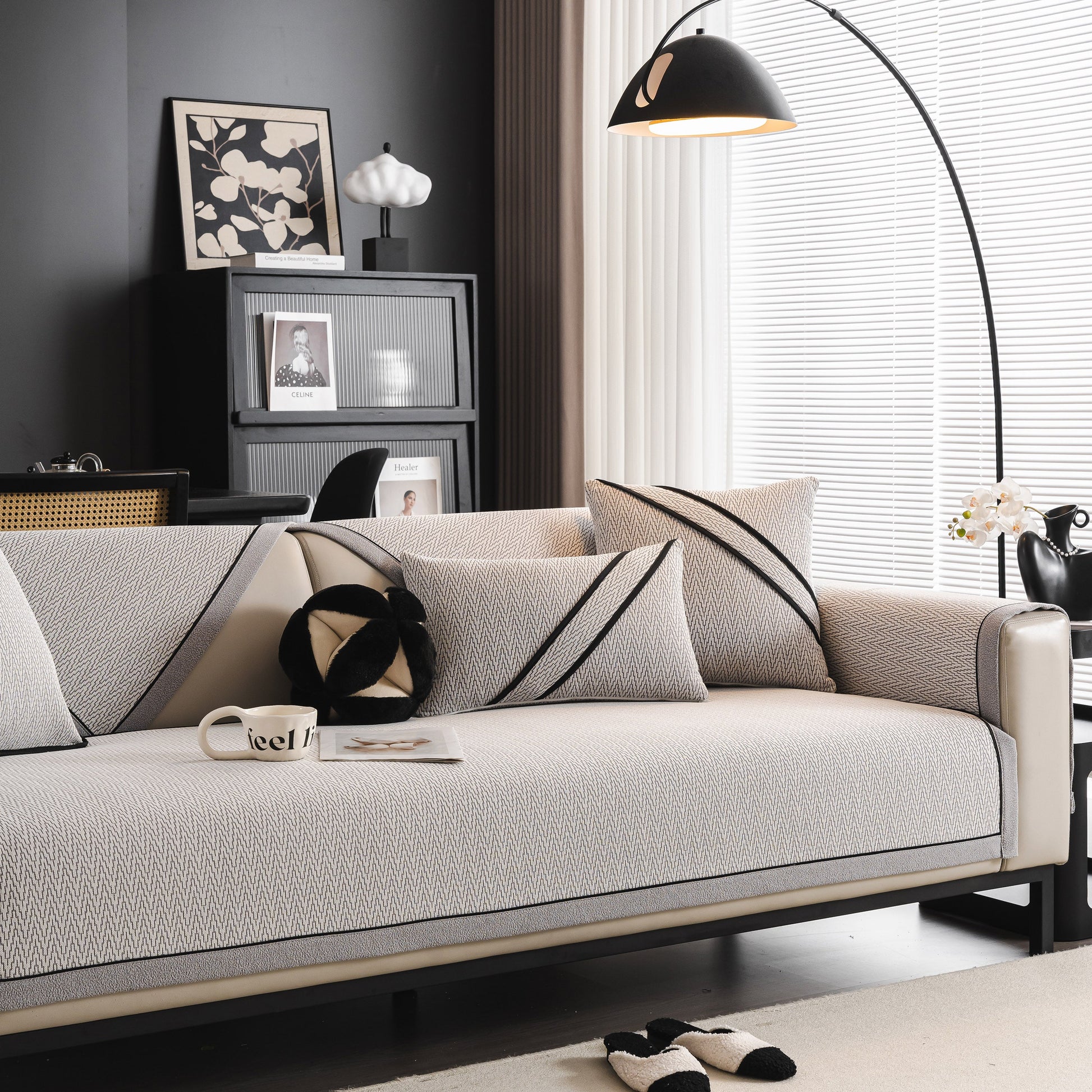 Living room featuring a sofa with Herringbone Couch Protector for Pets, Non-Slip Washable Sectional Couch Covers in a modern setting.