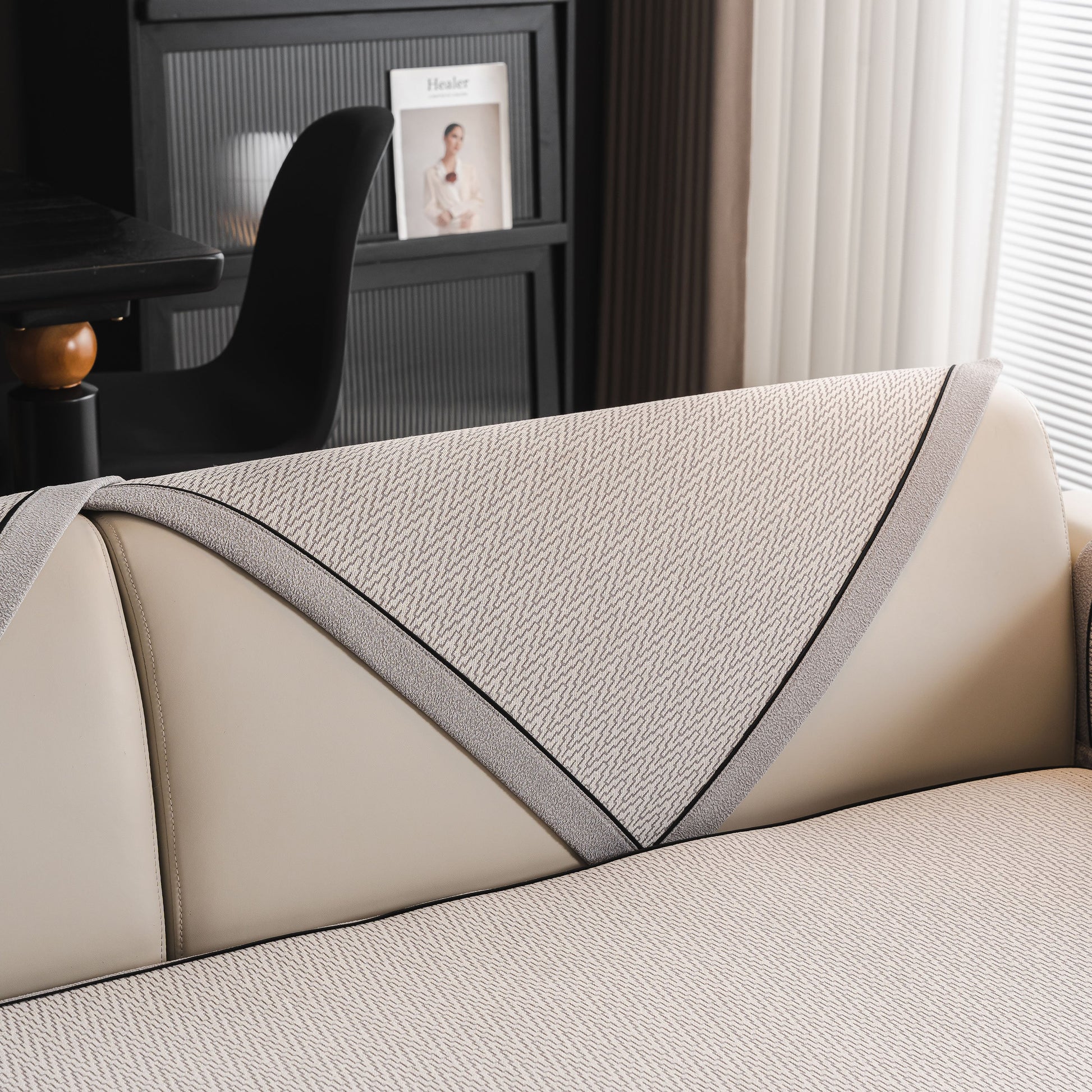 Close-up of Herringbone Couch Protector for Pets, Non-Slip Washable Sectional Couch Covers on a beige sofa with a herringbone pattern.
