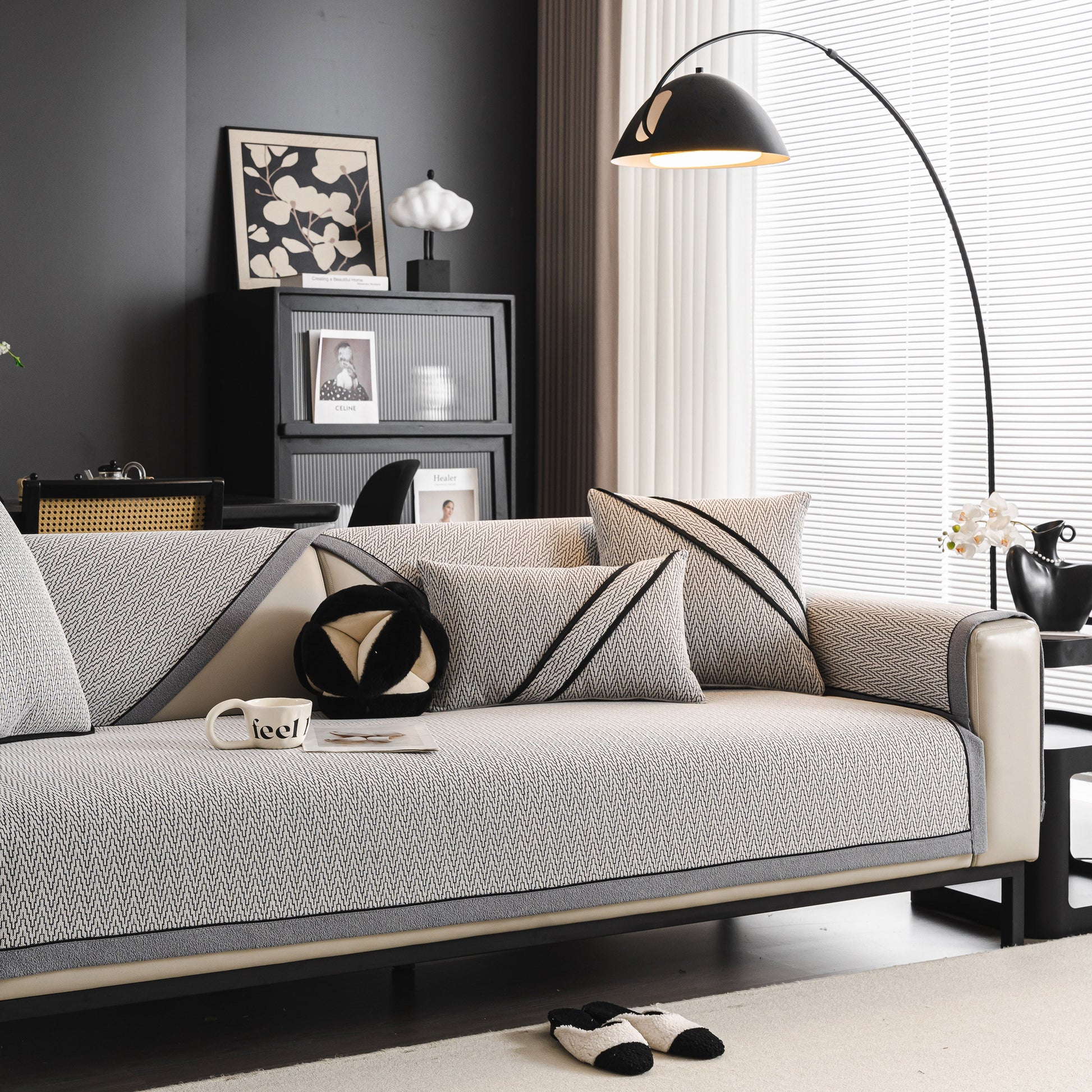 Elegant sofa with Herringbone Couch Protector for Pets, Non-Slip Washable Sectional Couch Covers in a modern living room setting