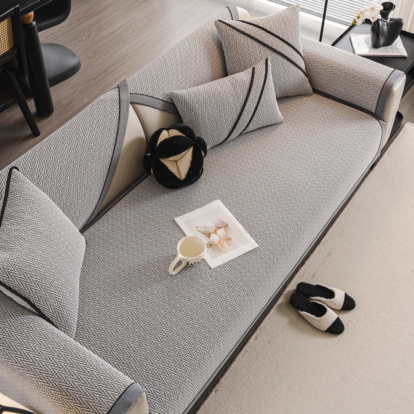 Herringbone Couch Protector for Pets, Non-Slip Washable Sectional Couch Covers on a grey sofa with matching pillows and slippers