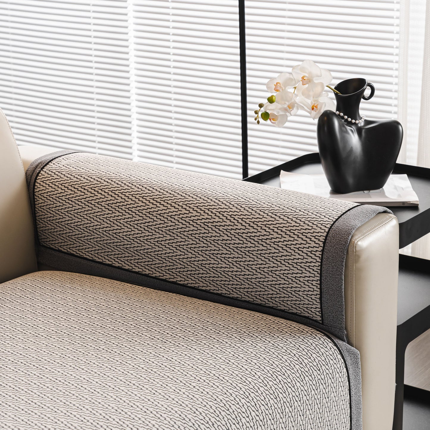 Herringbone Couch Protector for Pets, Non-Slip Washable Sectional Couch Covers on a beige sofa armrest.