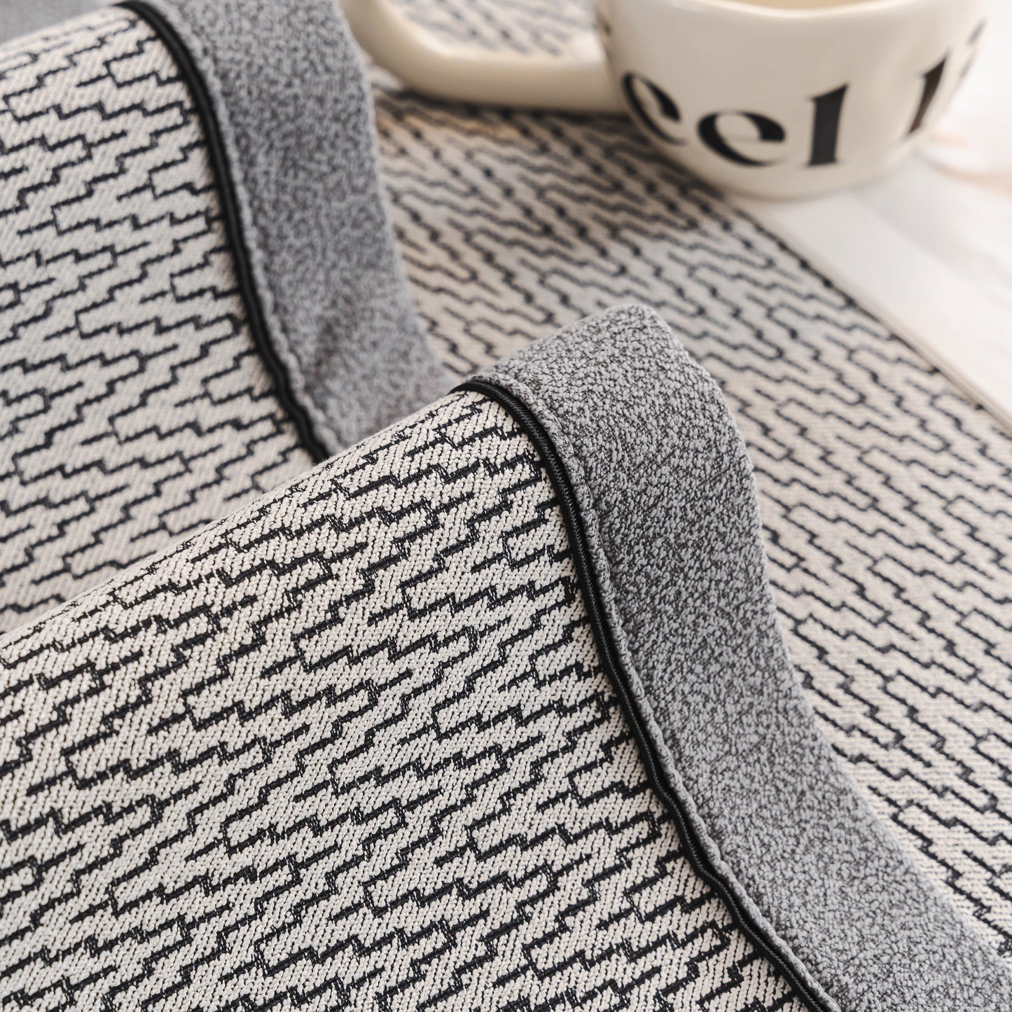 Close-up of Herringbone Couch Protector for Pets, Non-Slip Washable Sectional Couch Covers with piped edges and herringbone texture.